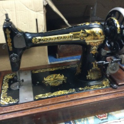 Two cased vintage Singer sewing machines. This lot cannot be posted