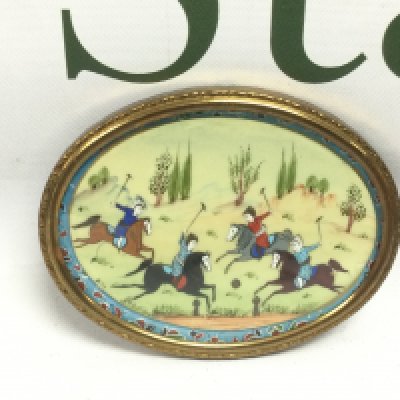 A framed miniature painting of a polo match, approx width 9cm. Shipping category D.