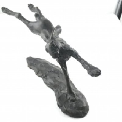 A Nelson and Forbes bronze flying hare. 22cm long and 10cm tall.Postage B
