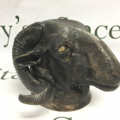 A bronzed bust of a ram's head, approx height 15cm. Shipping category D.