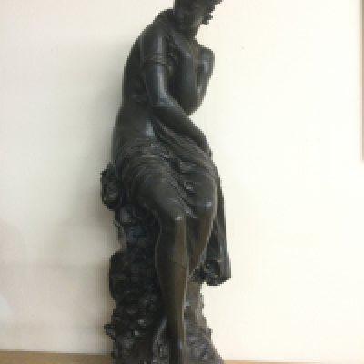 A large bronzed resin figure of a seated maiden, after Moreau, approx height 65cm. Shipping category D.