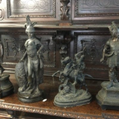 A bronzed figure of a female warrior plus three spelter figures of warriors, largest approx height 61cm. Shipping category D.