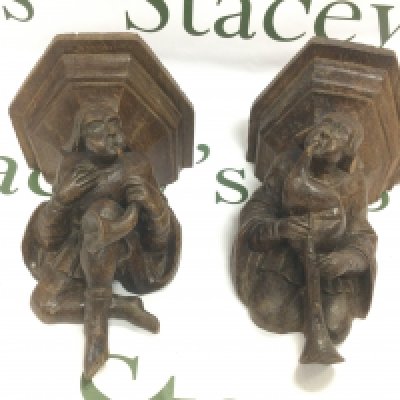 Two Misericords, possibly 14th / 15th Century depicting musicians. These carved wooden ledges, also known as Mercy Seats, were used in English cathedrals around this time so that wear monks could use them as support when standing for lengthy services. Some damage. Shipping category D.