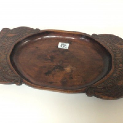 An interesting late 19th century carved hardwood dish carved from one piece of wood and possibly Aboriginal of origin. Each end with carved pattern and flanked by birds. Good condition postage available length 52cm