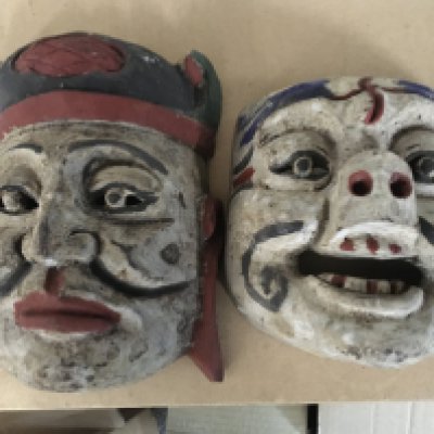 Five carved masks.