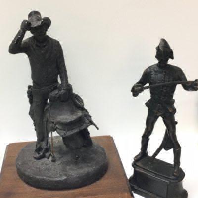 A continental bronze figure of Hadik Hussar marked Kisfaludi Strobl and a Cowboy figure marked 1982 Micheal Garman. Presented by Dick Cheney secretary of defence, United States of America. 26 & 31cm tall. Postage category B