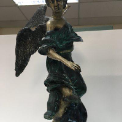 A bronzed figure of an angel. 55cm tall. This lot cannot be posted