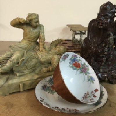 Two soapstone oriental carvings and a Chinese tea bowl