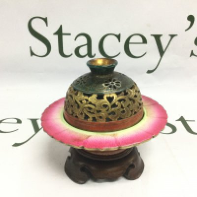 An Oriental censer with giltwork decoration and raised on a carved hardwood base, approx total height 11cm. Shipping category D.