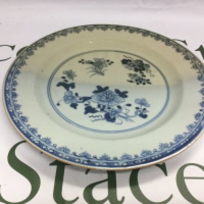 A Chinese blue and white dish decorated with floral sprays, approx diameter 23cm. Shipping category D.