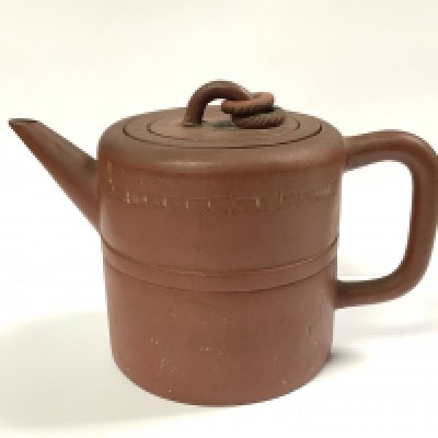 An early Yi-Xing terracotta pottery teapot with internal filter, sgraffito decoration to body and 4 character impressed mark to base. (D)