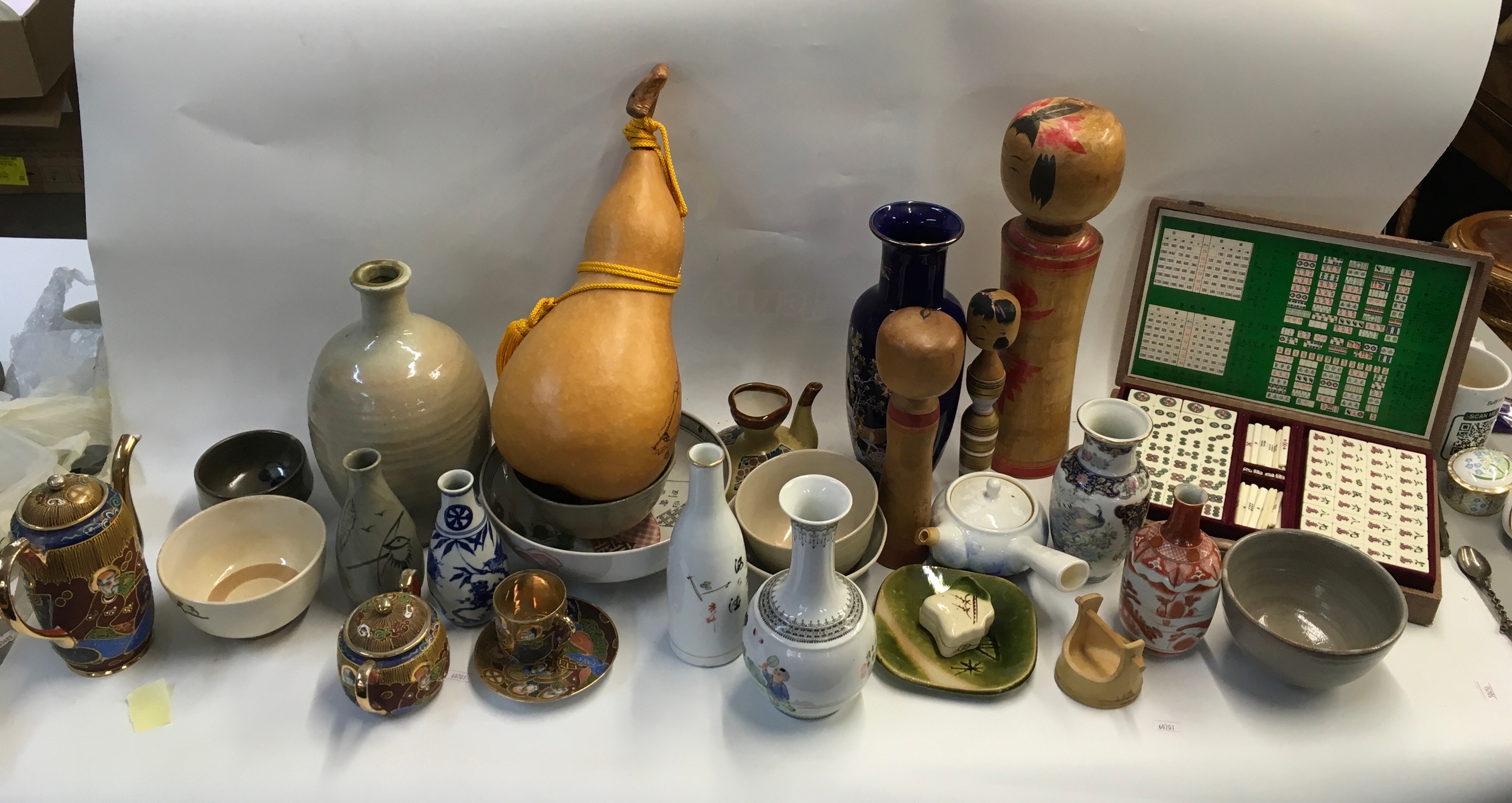A collection of oriental and ceramic items