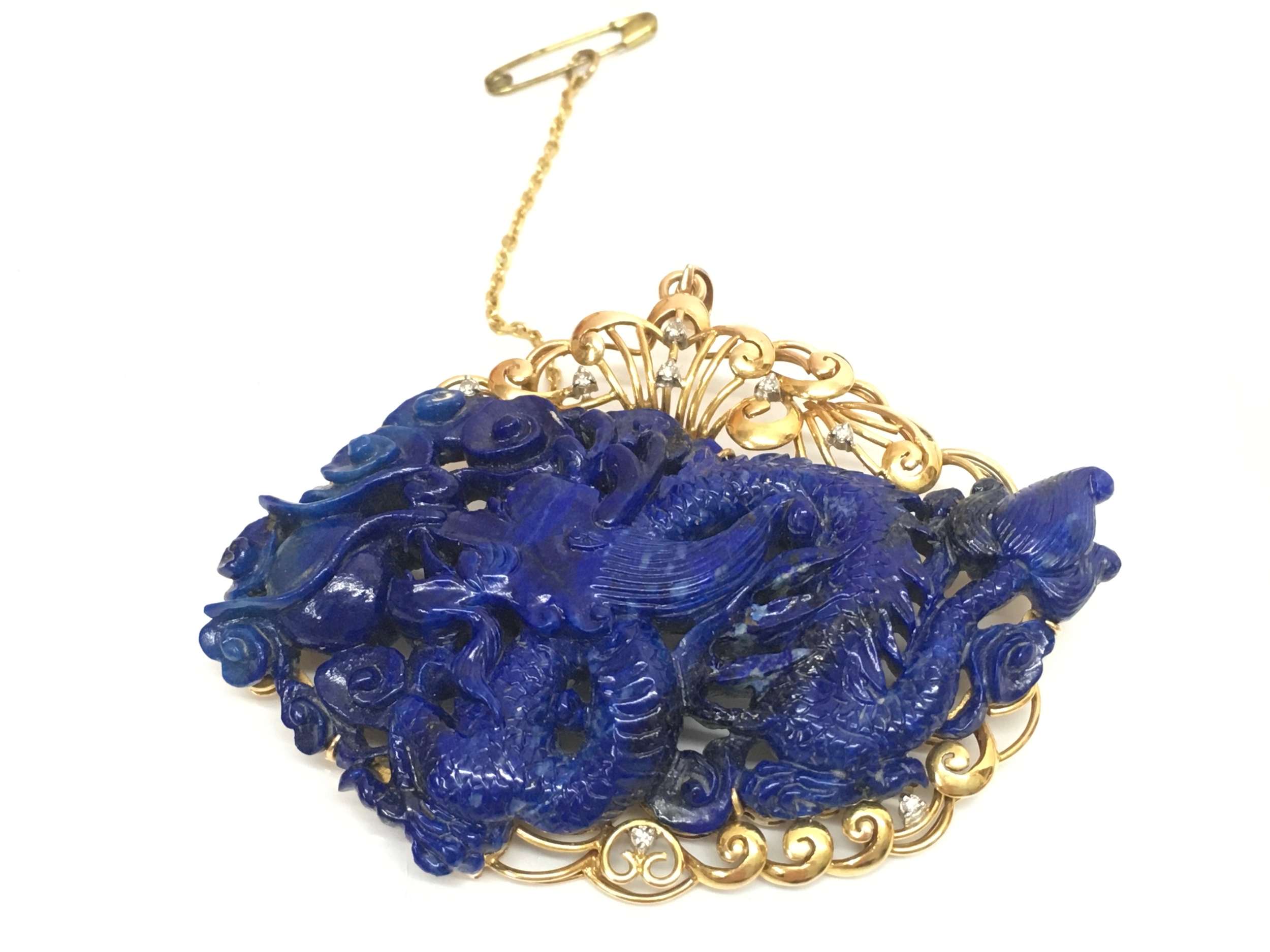 A 14ct gold mounted Chinese hand-carved blue lapis lazuli dragon brooch set with diamond stones. 7.5cm wide. 39g total weight