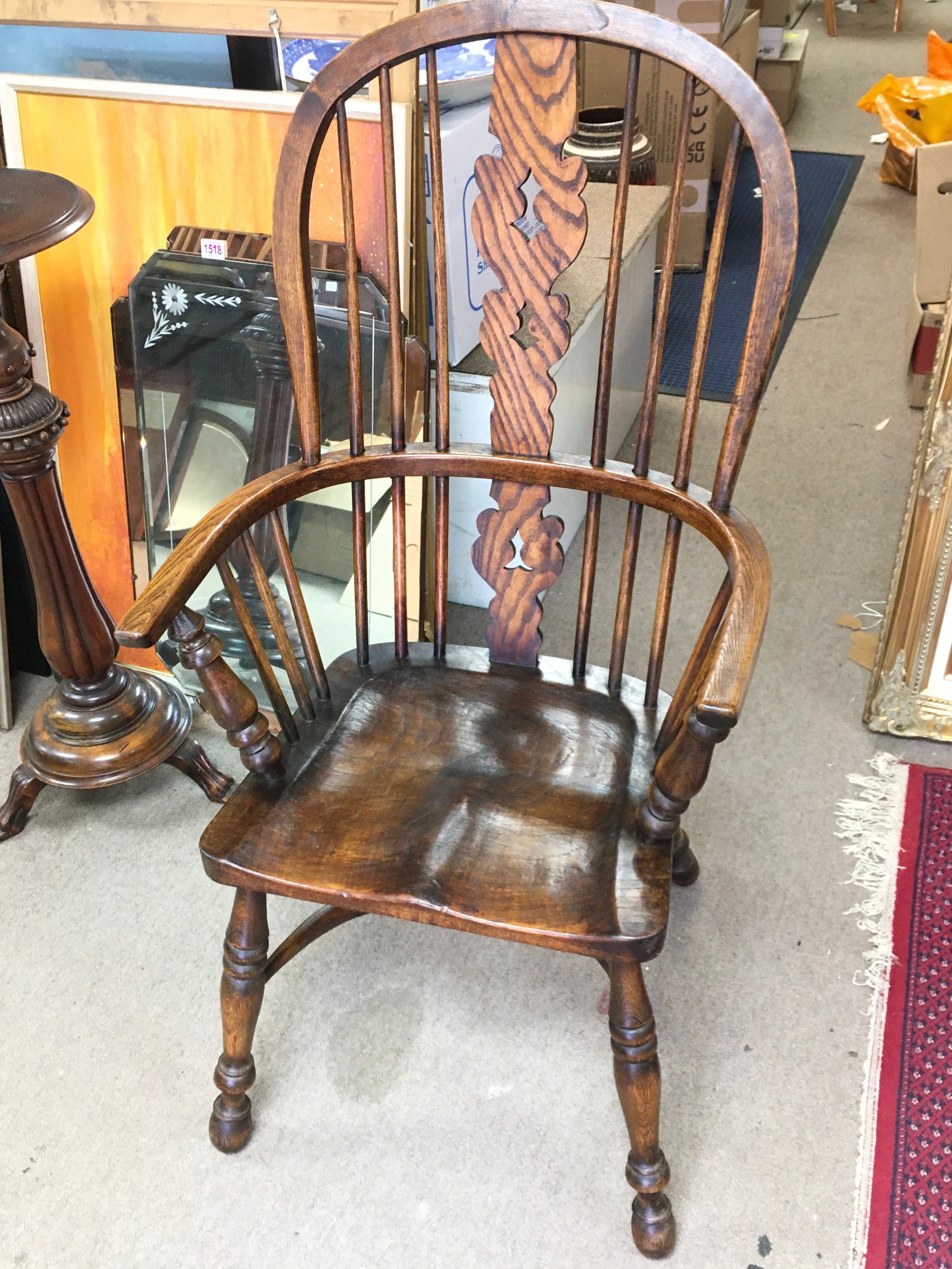 An elm chair with open arms . 113cm tall 58cm wide 39cm long