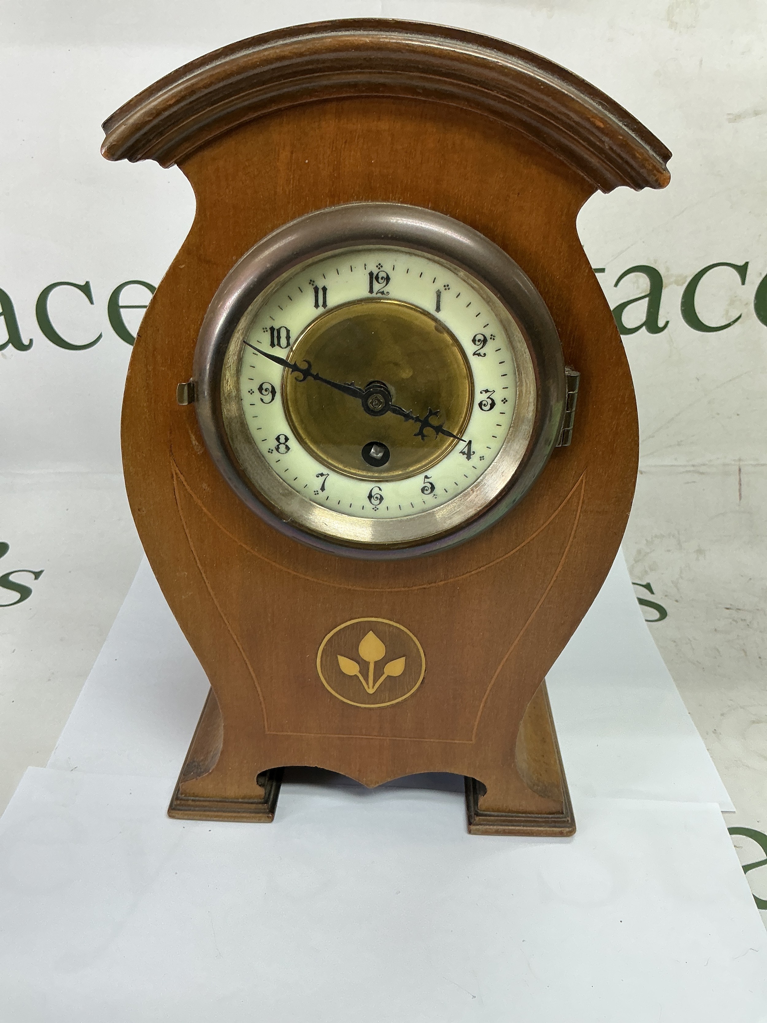 An inlaid mantle clock with Arabic numerals, approx height 29cm.
