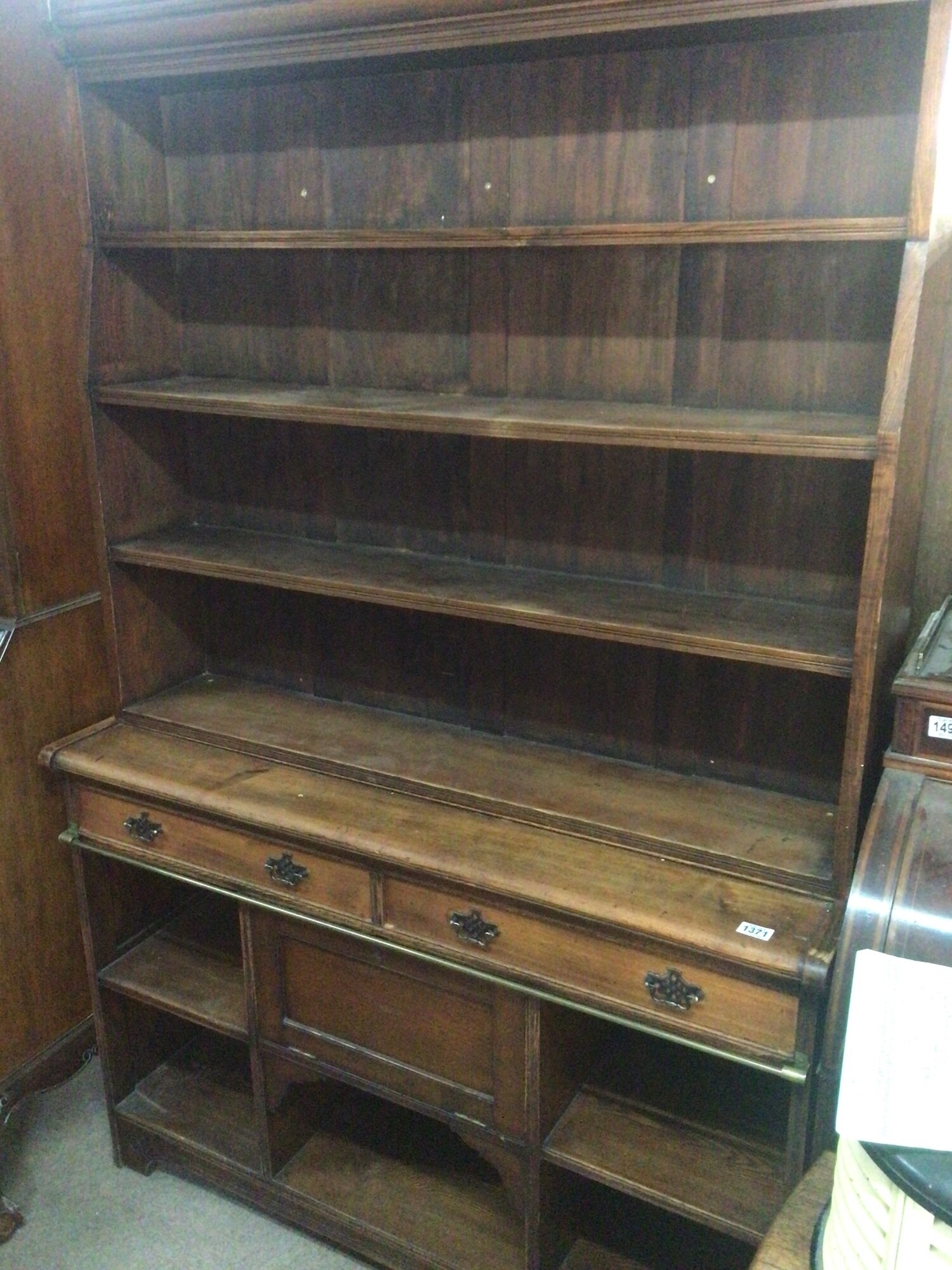 An Edwardian stained pitch pine and oak open bookcase with four open shelfs above two drawers and further open shelves. 210 High 125 wide good original condition. TO BE SOLD WITHOUT RESERVE