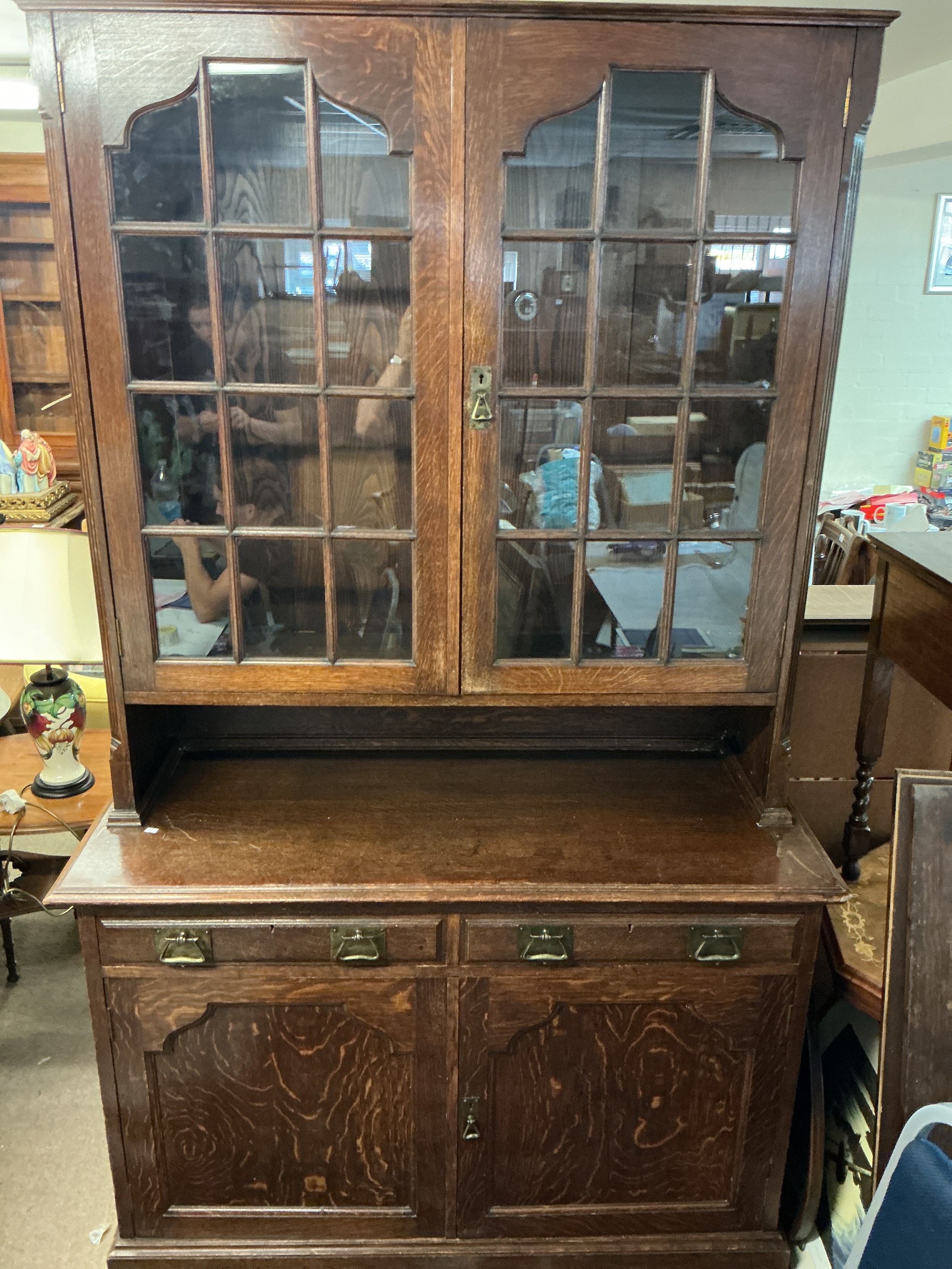 An oak Arts & Crafts bookcase, approx 220cm x 129cm x 55cm.