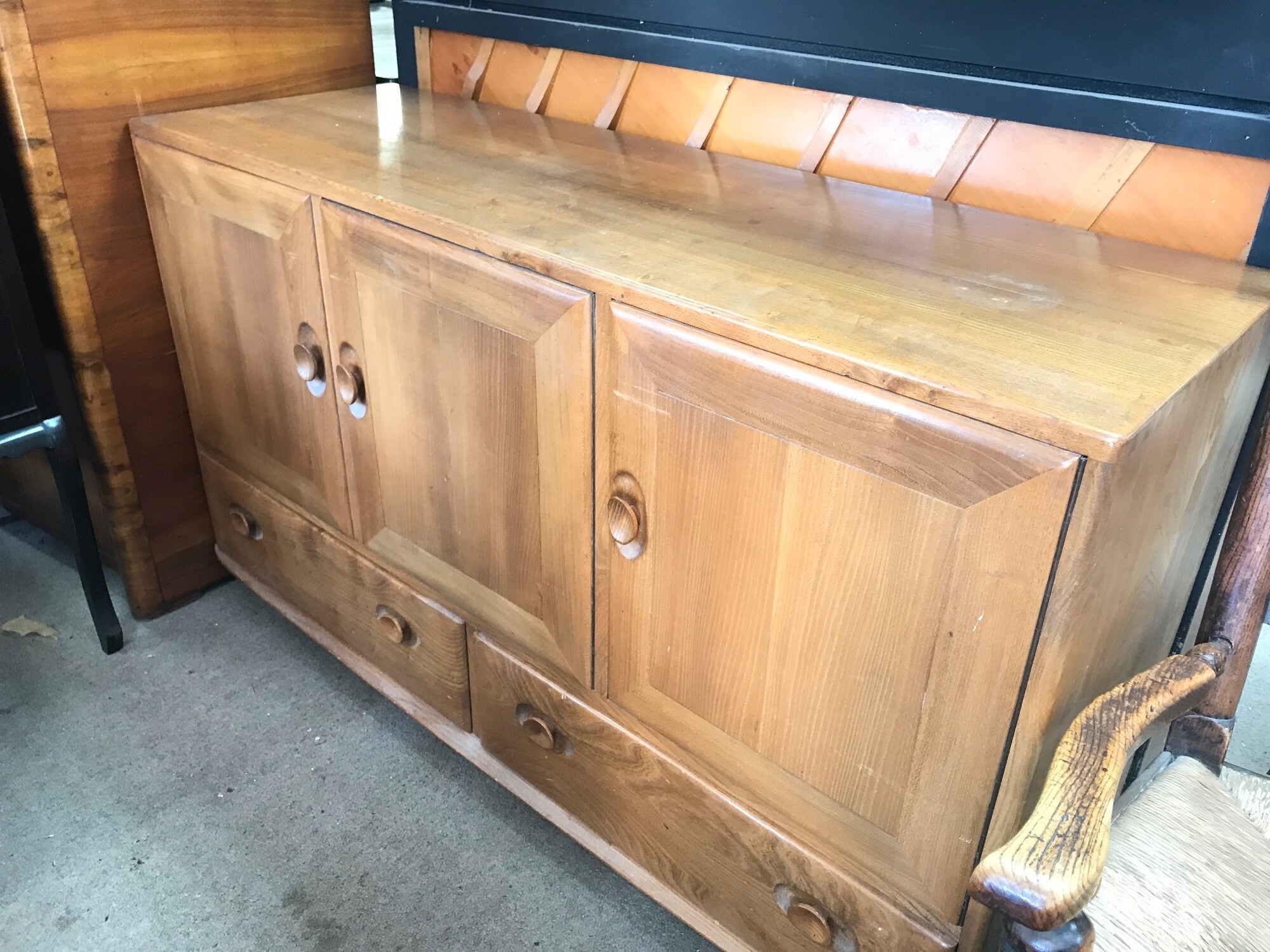 An Ercol Windsor sideboard 128cm wide 44cm long , 75cm tall