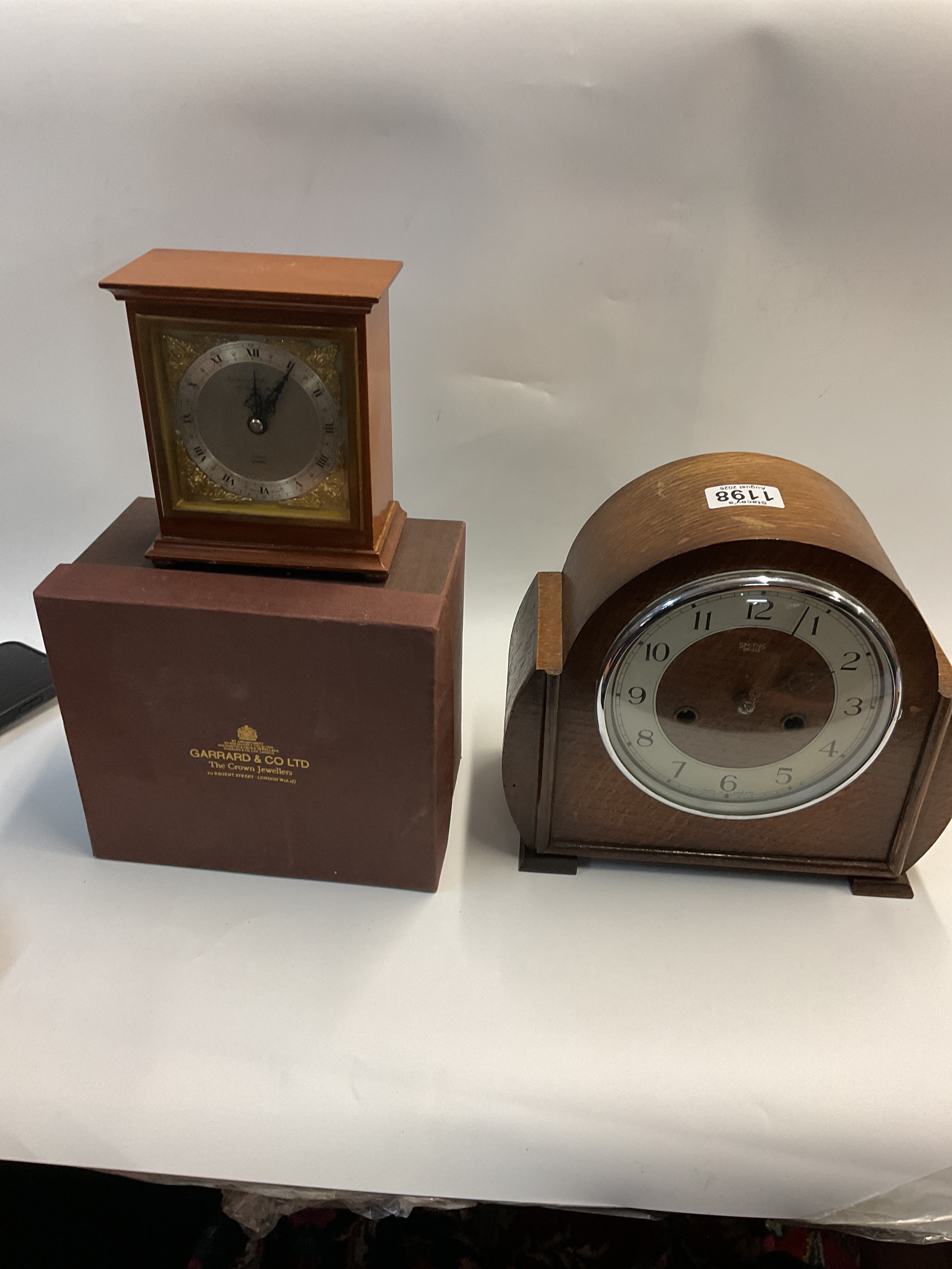 Cased Garrards clock and 1930s example.