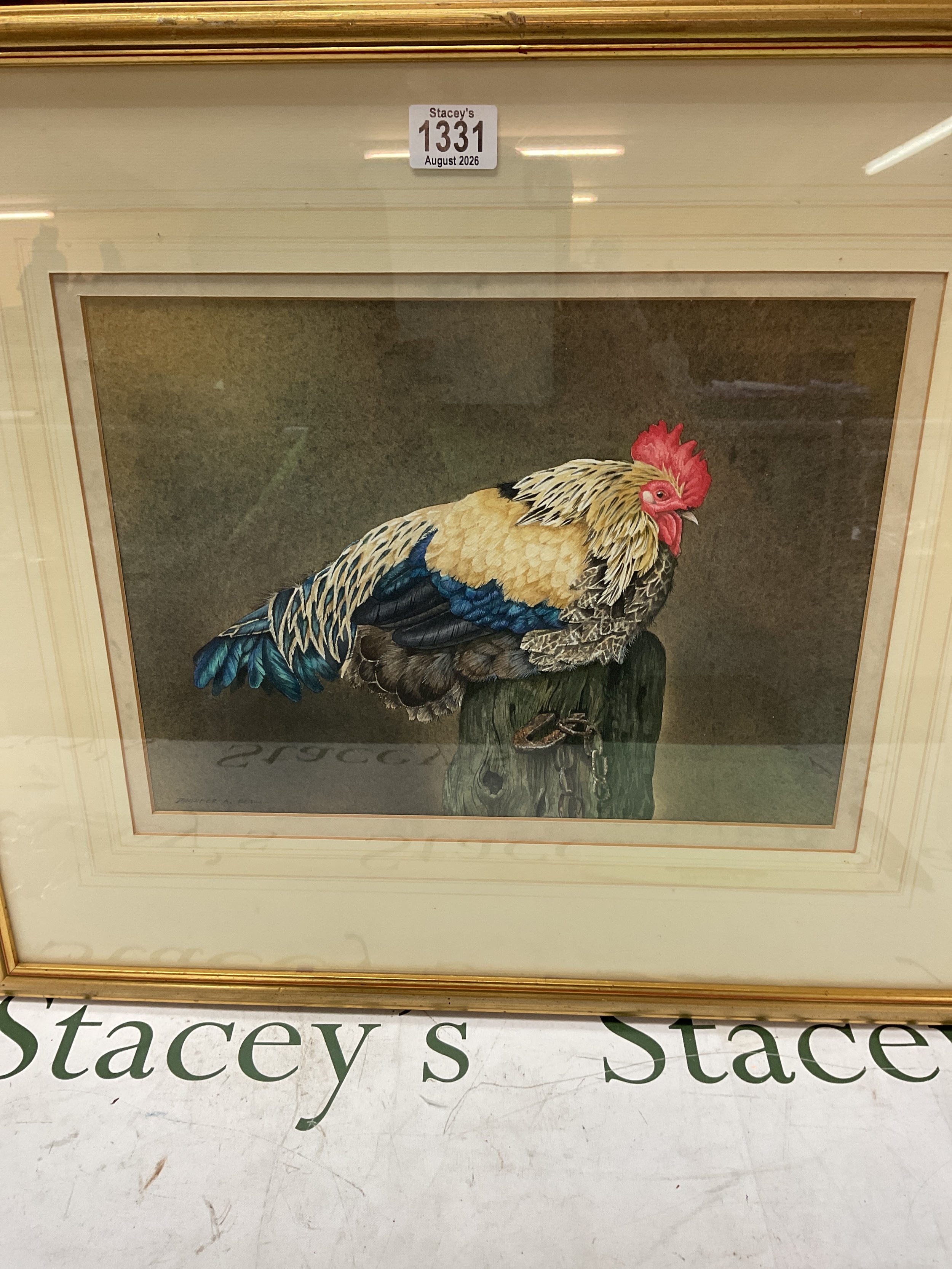 Jennifer A Bell watercolour of a cockerel on a post, 28 cm x 38 cm signed lower left, framed and glazed in gilt frame.