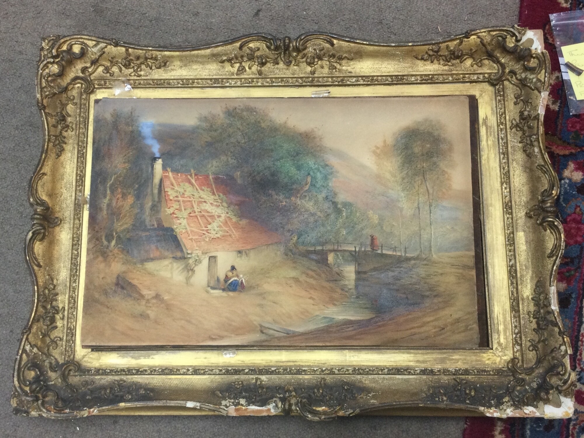 An unsigned Victorian watercolour village view, framing in need of restoration