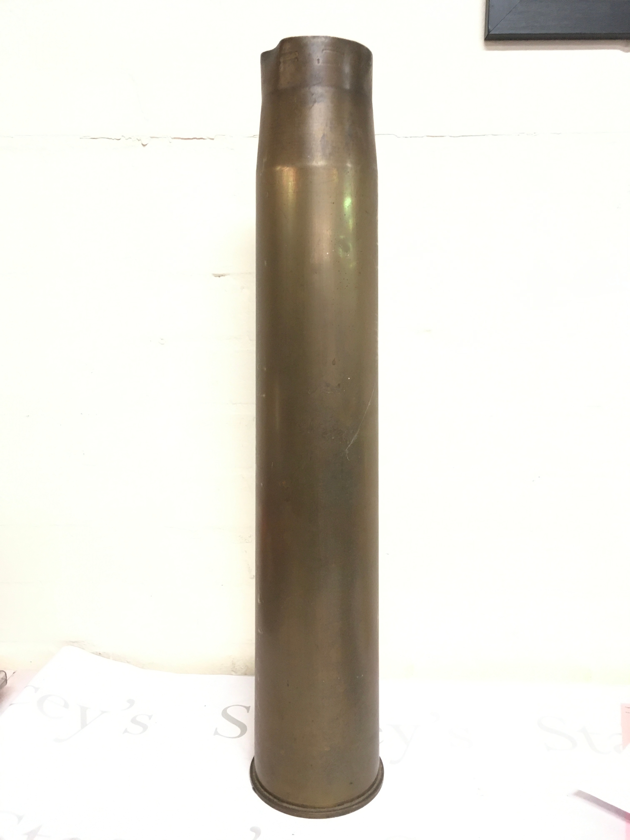 A 1942 artillery shell, 67cm tall. Base reads 3.7" GUN I LOT 748 ECC CFF. No reserve 