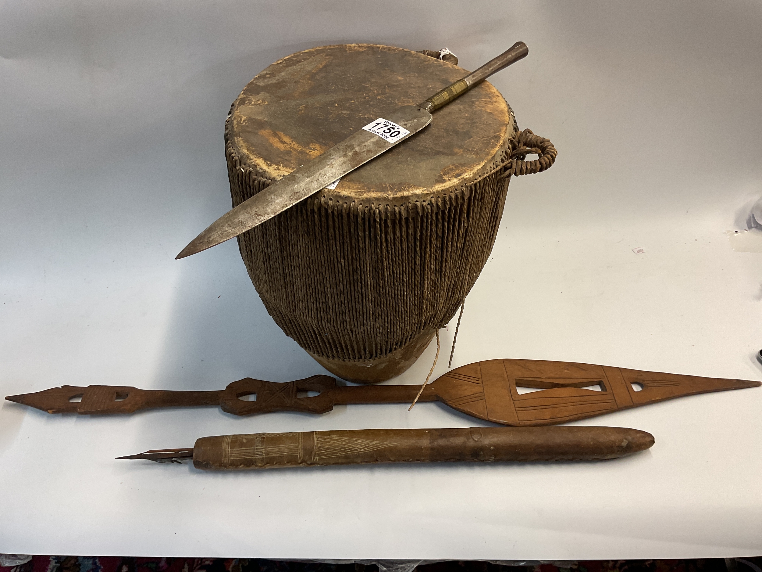 19th c African spear head, hammered metal with fine weaving to the stem along with a drum, paddle and quiver with arrows and blow dart.