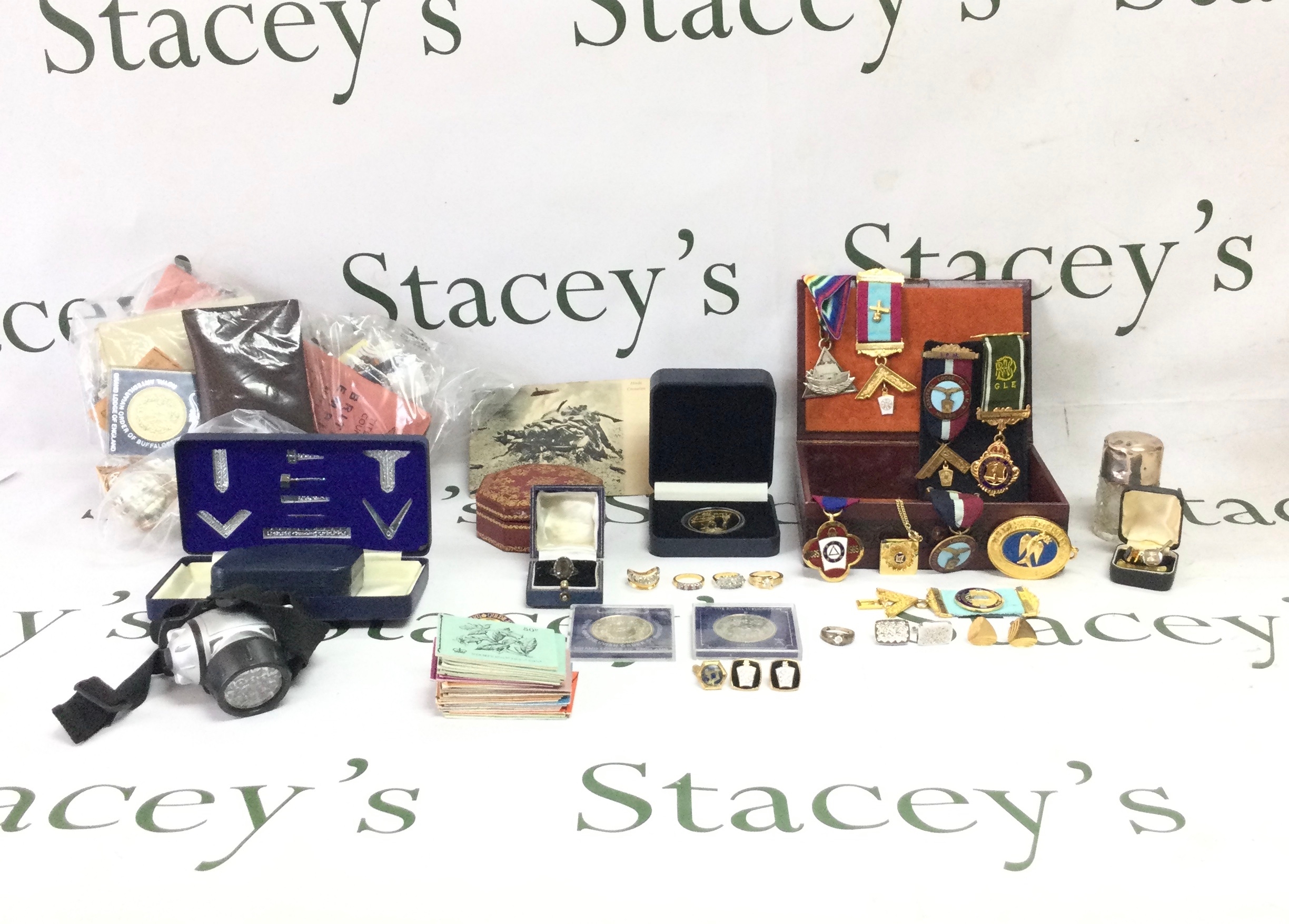 A varied collection of vintage and modern Collectables such as jewellery and badges, silver and base metal coins, vintage documents and stamps.