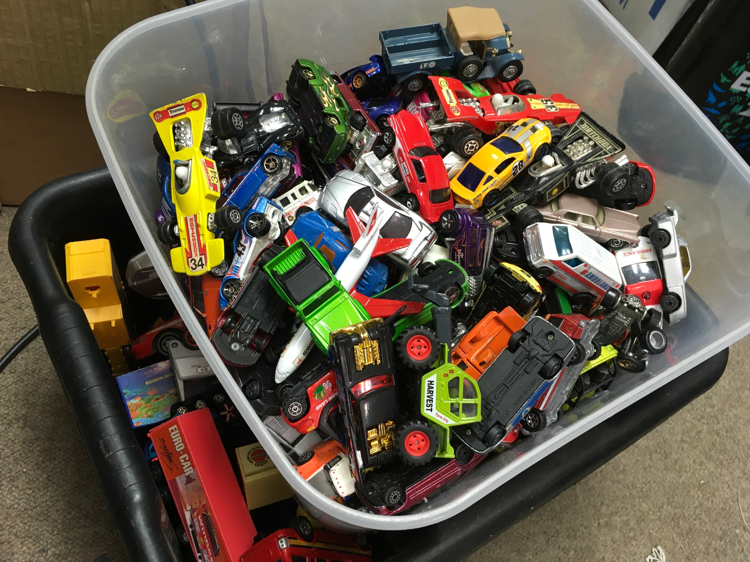 Two boxes of unboxed model vehicles including a large amount of hot wheels 