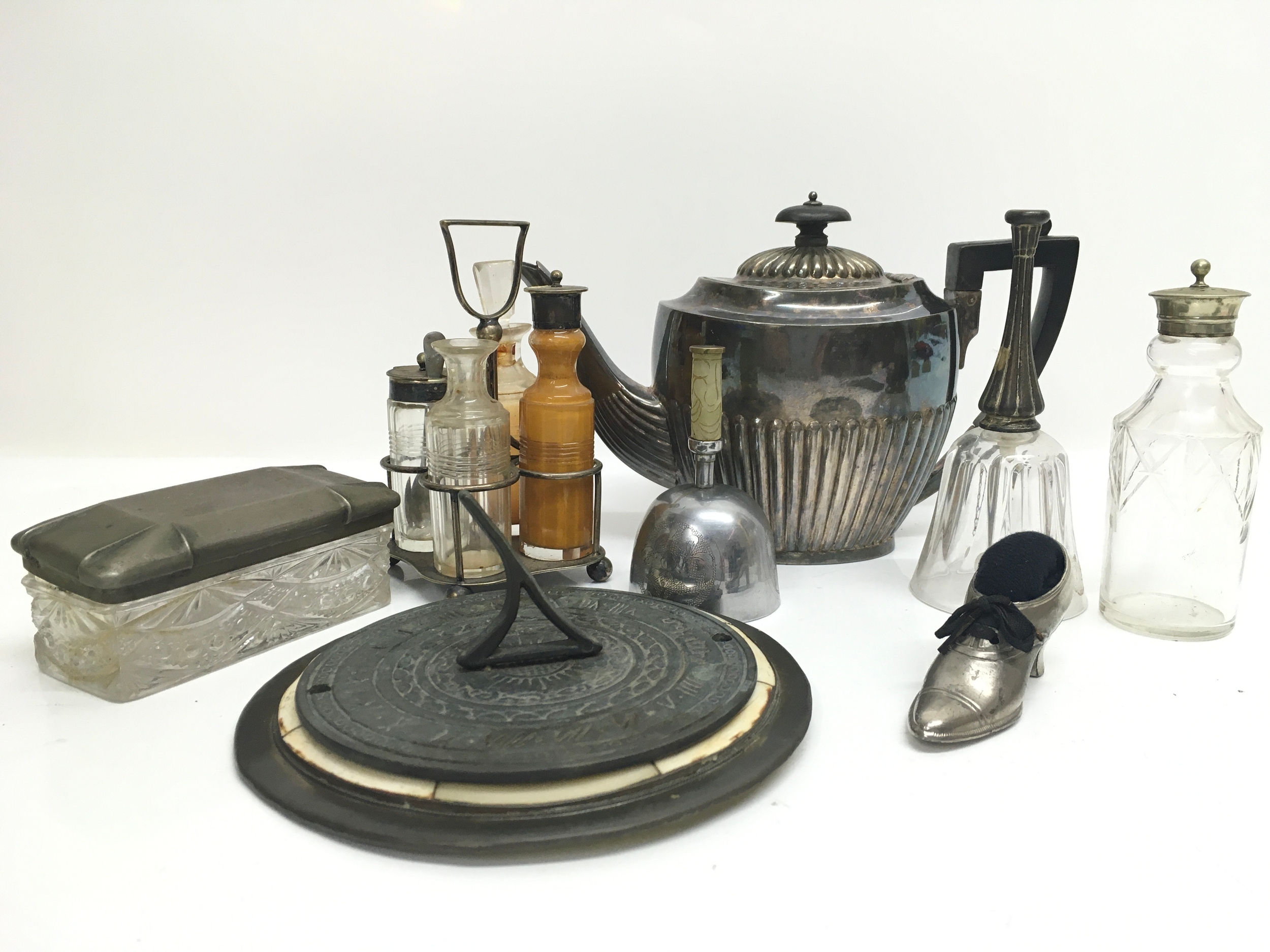 A quantity of items including a chinese bell, bronze sun dial, cruet and shoe pin cushion