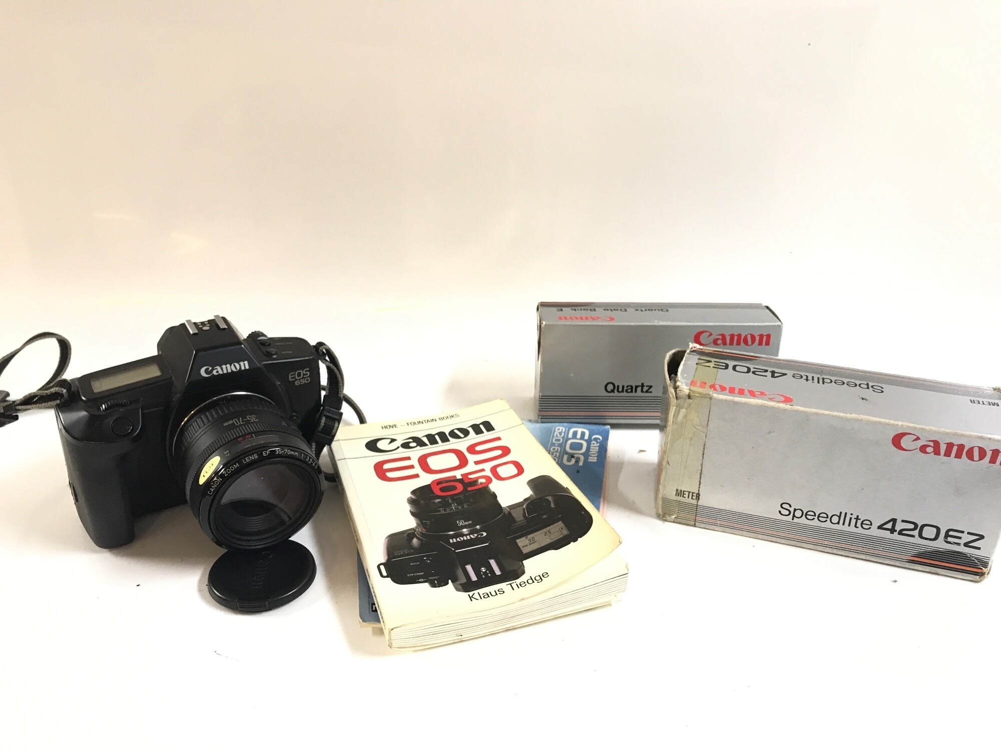 A canon EOS with some accessories NO RESERVE