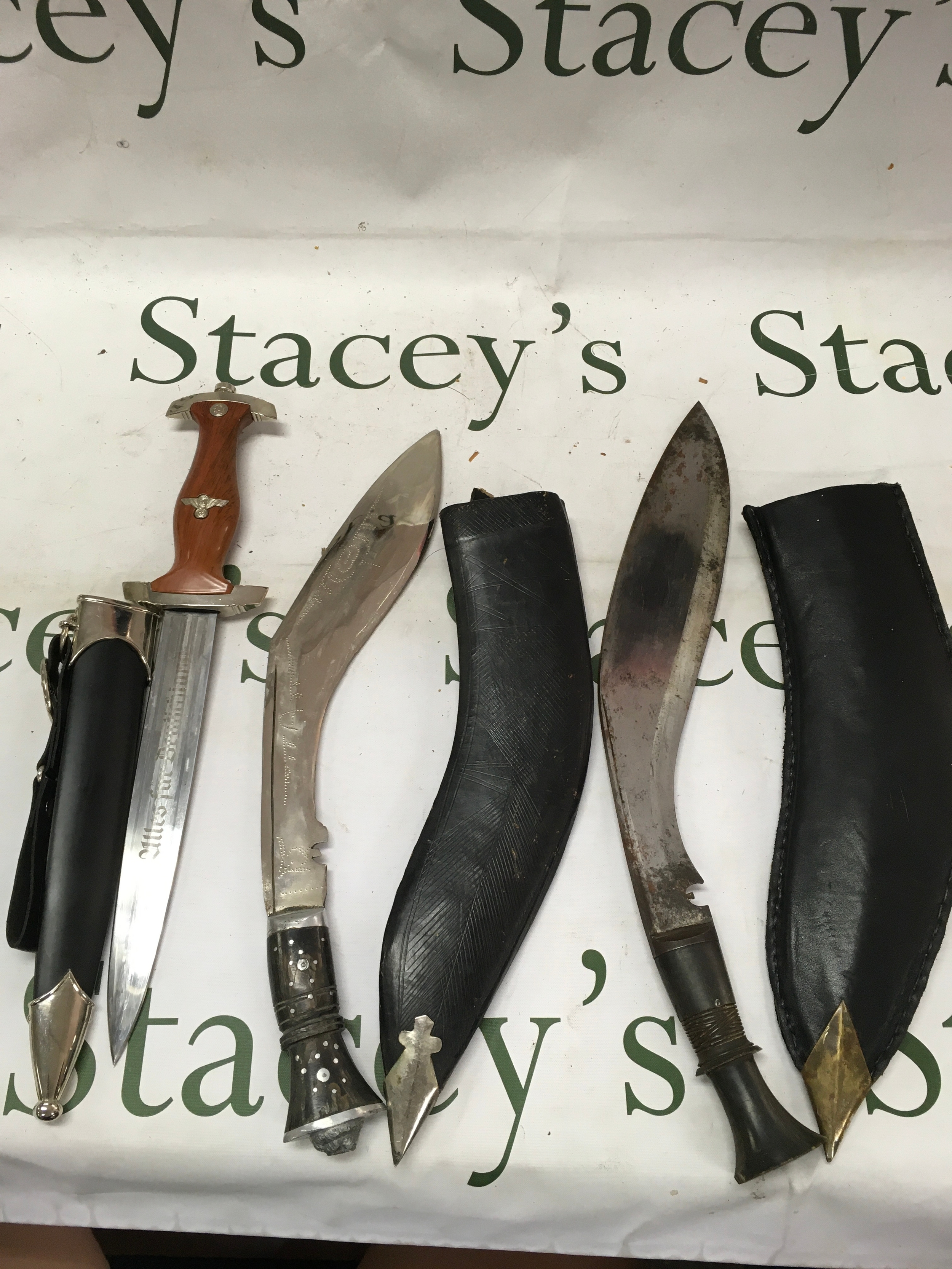 3 daggers including a commemorative Nazi dagger, a kukri ornate decorative example, a kukri traditional field grade.