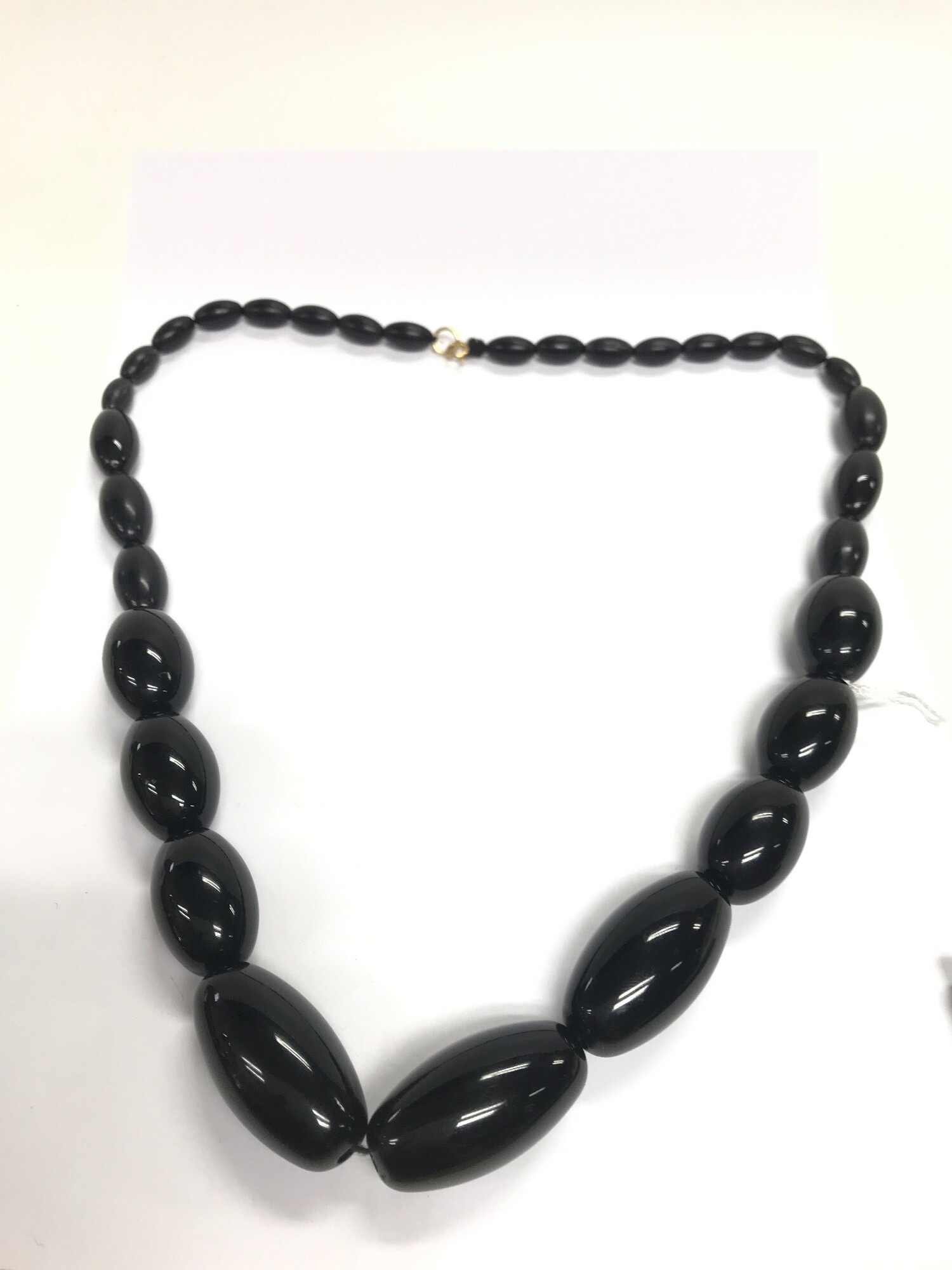 A vintage necklace in style of amber or Bakelite , not tested. 68cm, 95 grams with golden clasp hallmarked for 375 (9ct gold) NO RESERVE