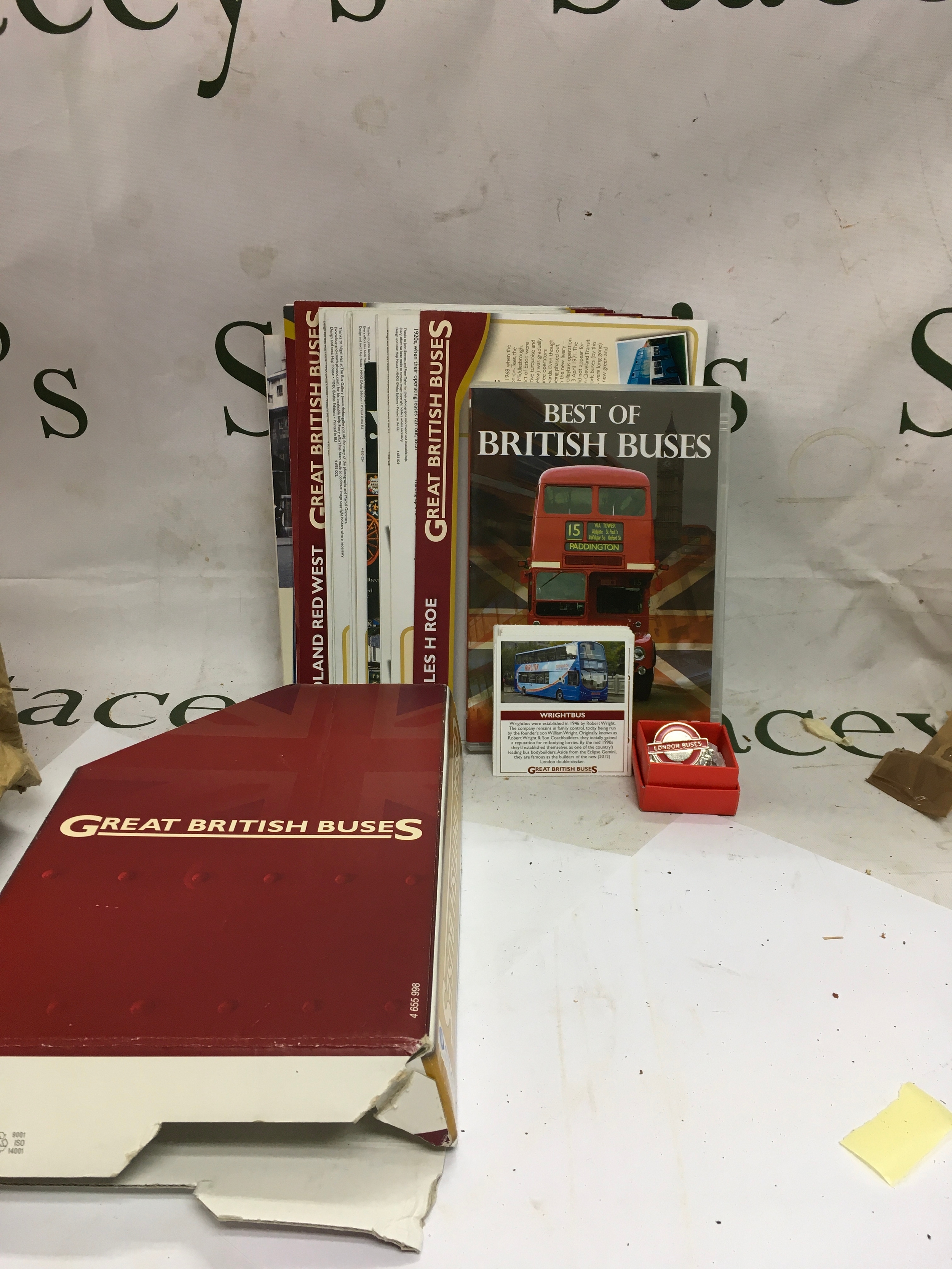 A collection of different London Bus information including things like leaflets, a DVD, a booklet, etc. 