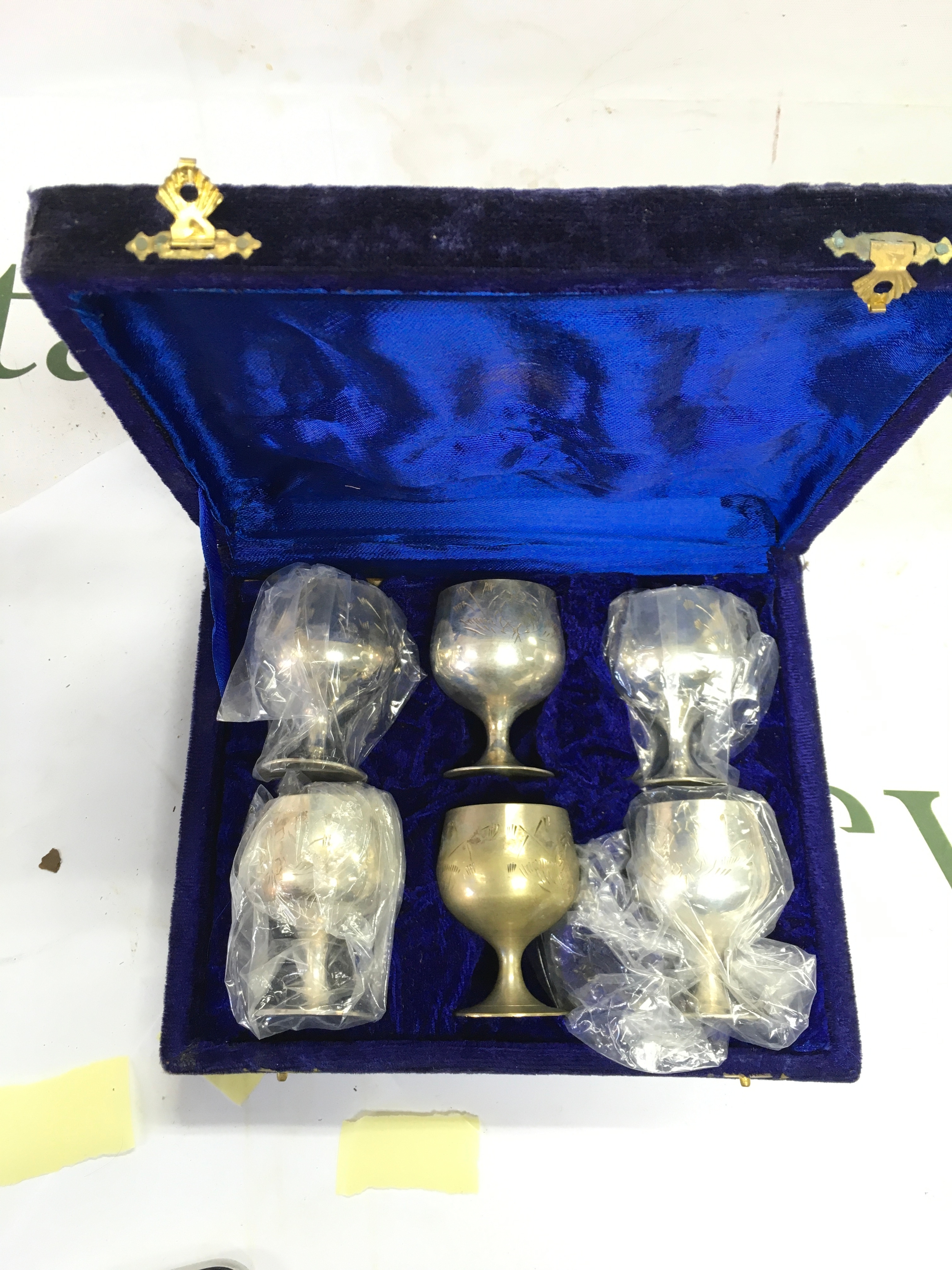 A set of 6 identical brass miniature goblets. 