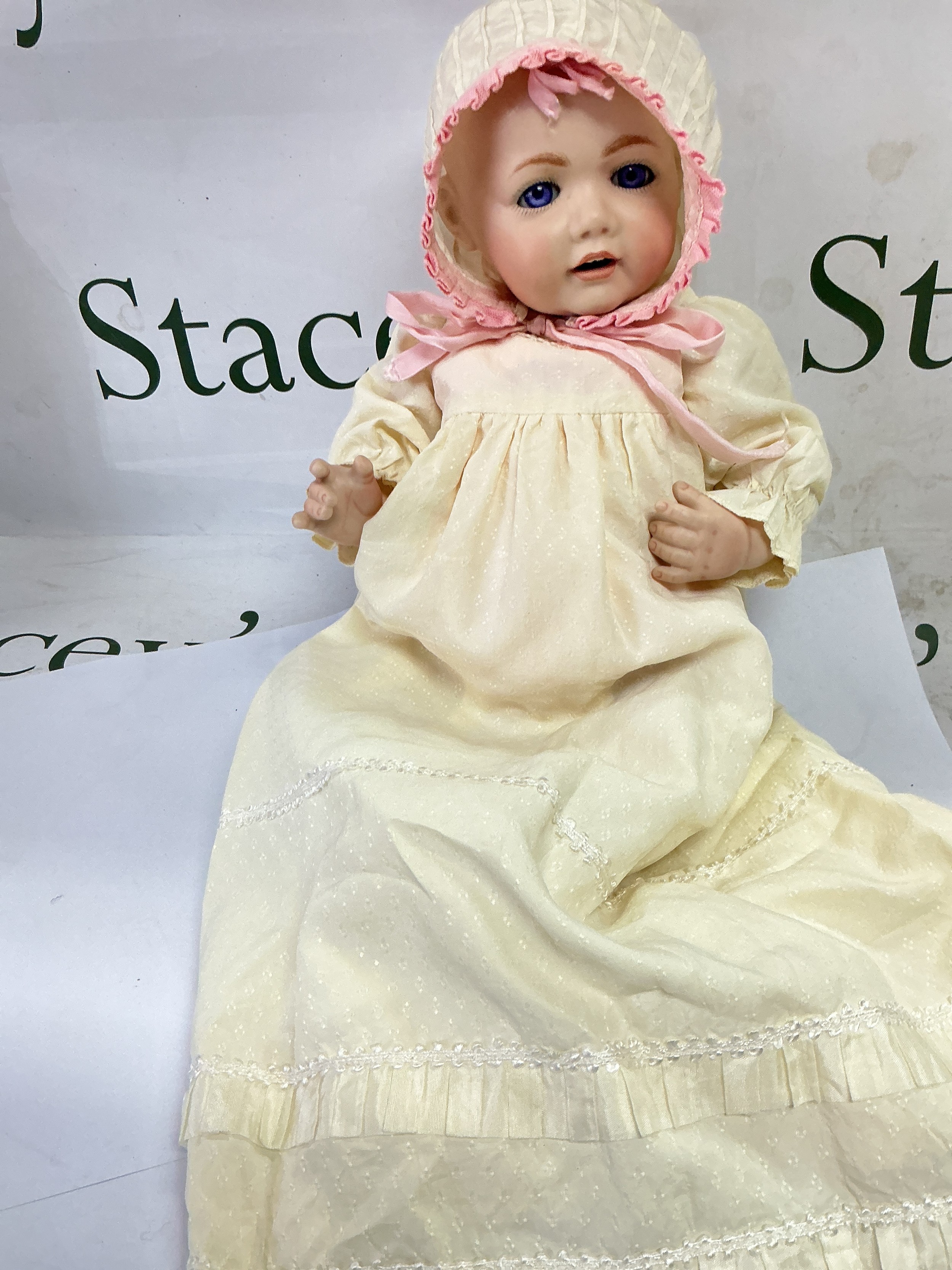 A bisque headed doll, approx length 42cm.