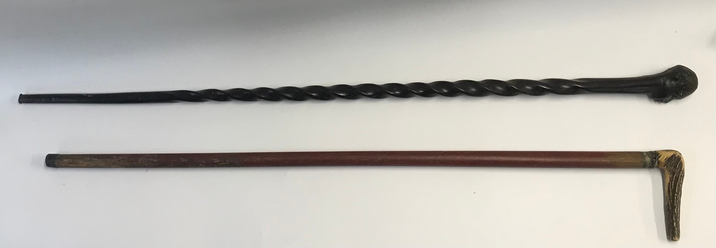 Two vintage walking sticks. 