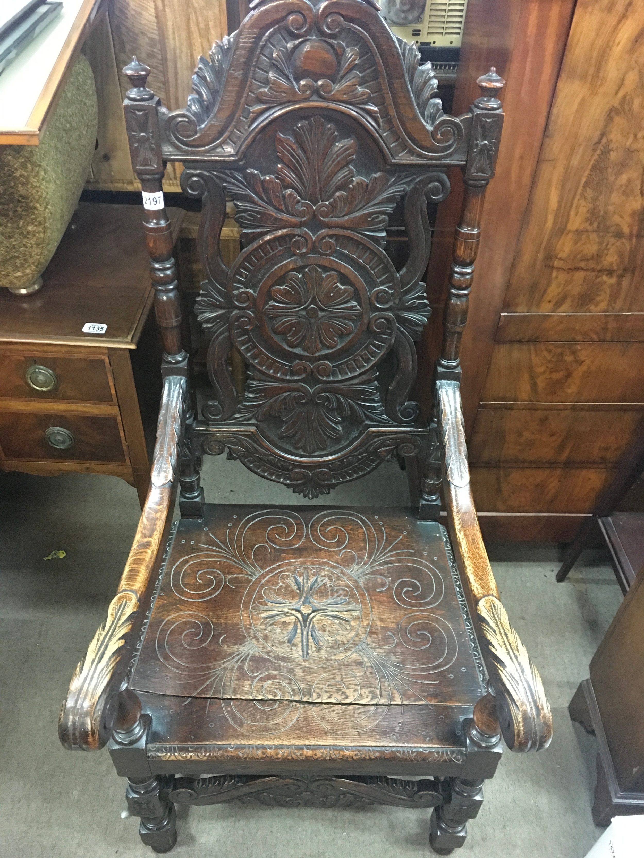 A large cak carved open armchair 