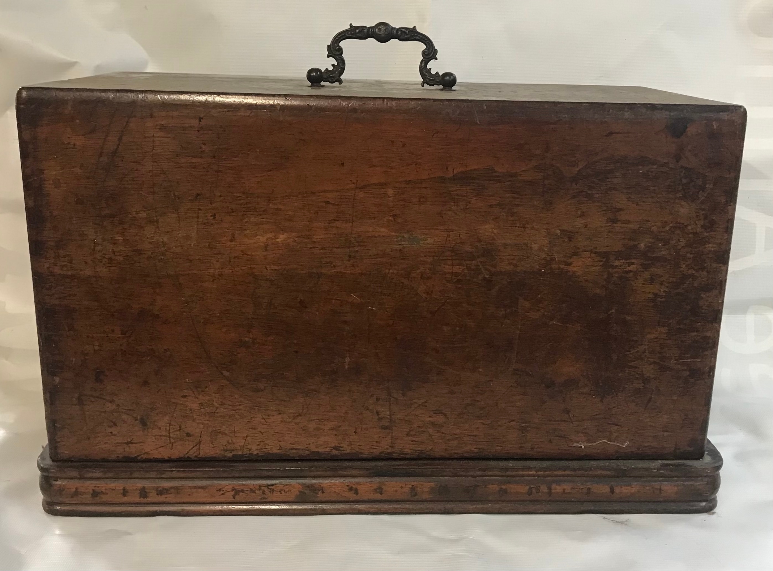 Vintage walnut-cased sewing machine in fitted locked wooden case, comes without key.
