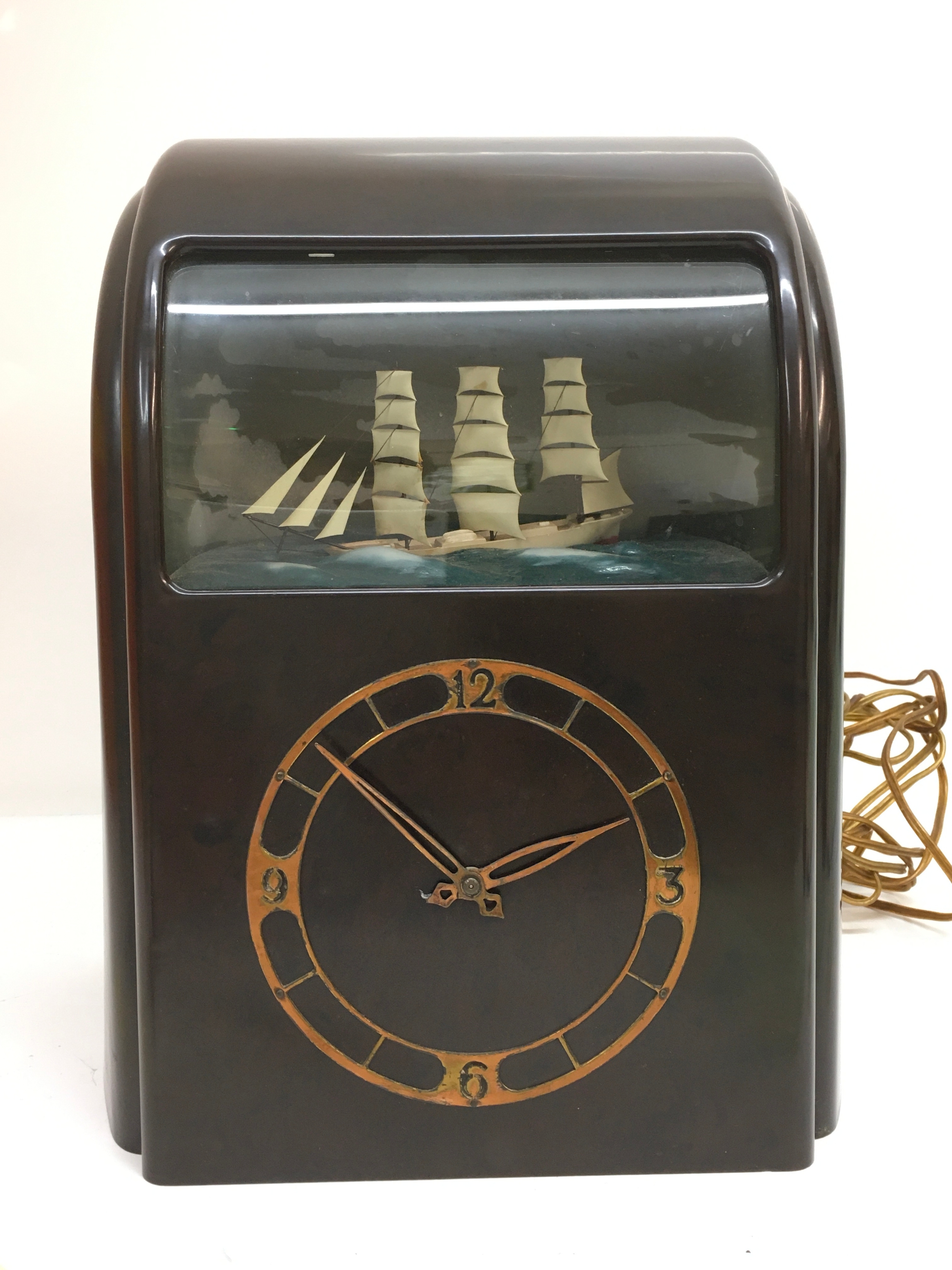 A mid 20th century Bakelite electric clock Rocking Ship Automation. 32cm tall 24cm wide 17cm long