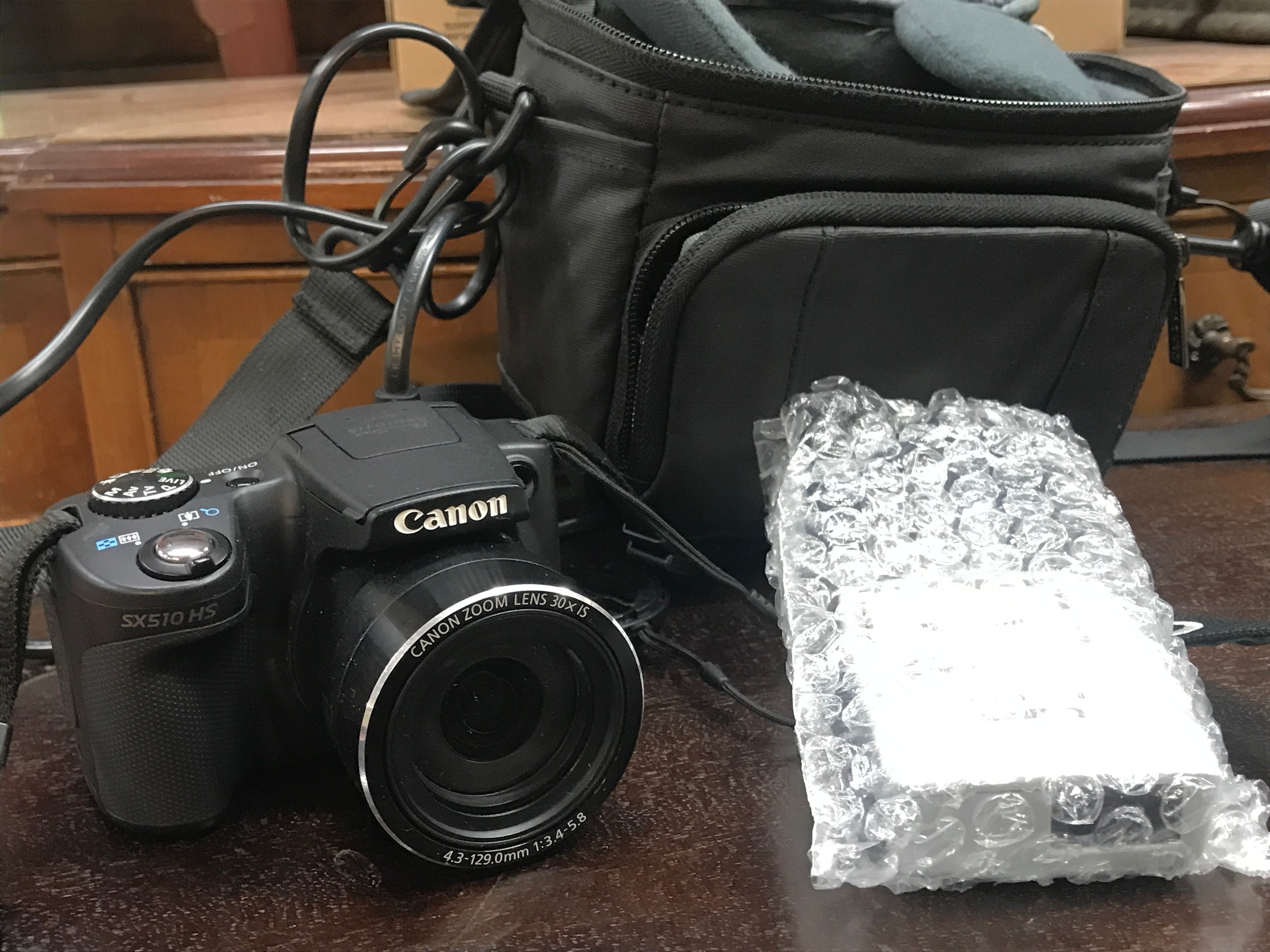 A Canon PowerShot SX510 HS Digital Camera, seen working