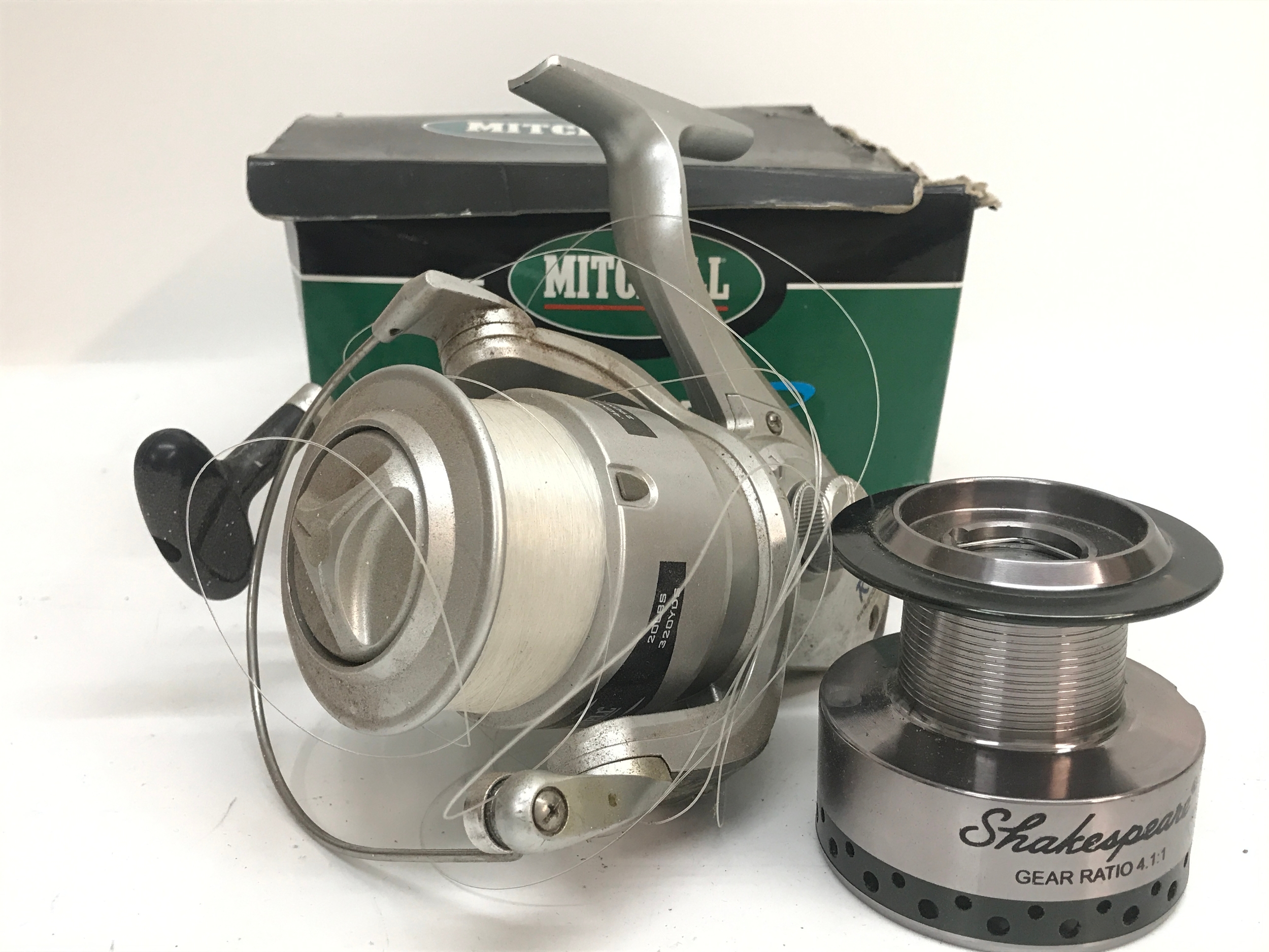 Two beach casting fishing Rod and a boxed Mitchell Bluewater R 8000 sea reel, no reserve