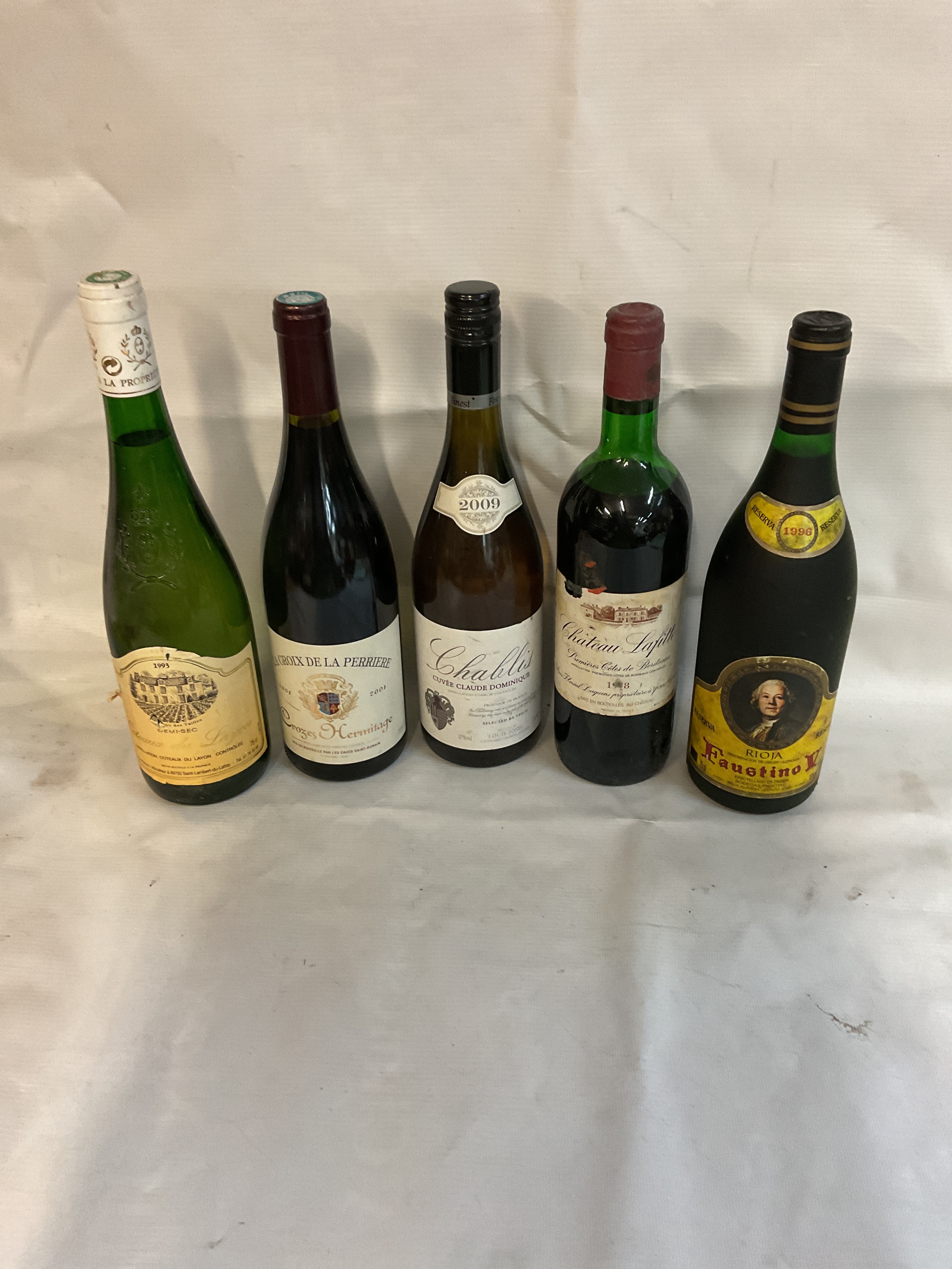 Five bottles of wine to inc, 1993Coteaux du Layon, 2008 LaCroix de la Perriere, 1978 Chateau Lafitte, and a Faustino V.