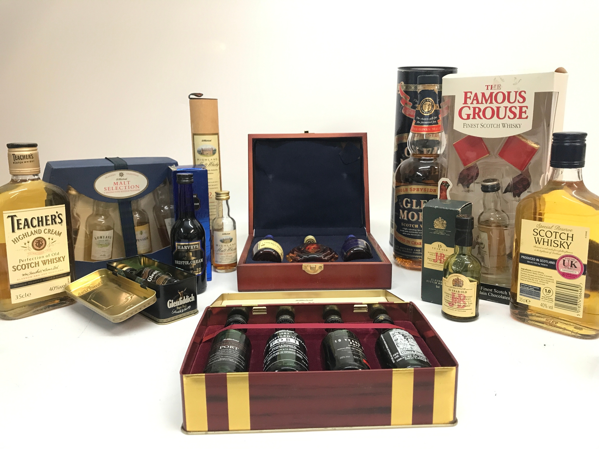 A box containing whiskeys and cognac 