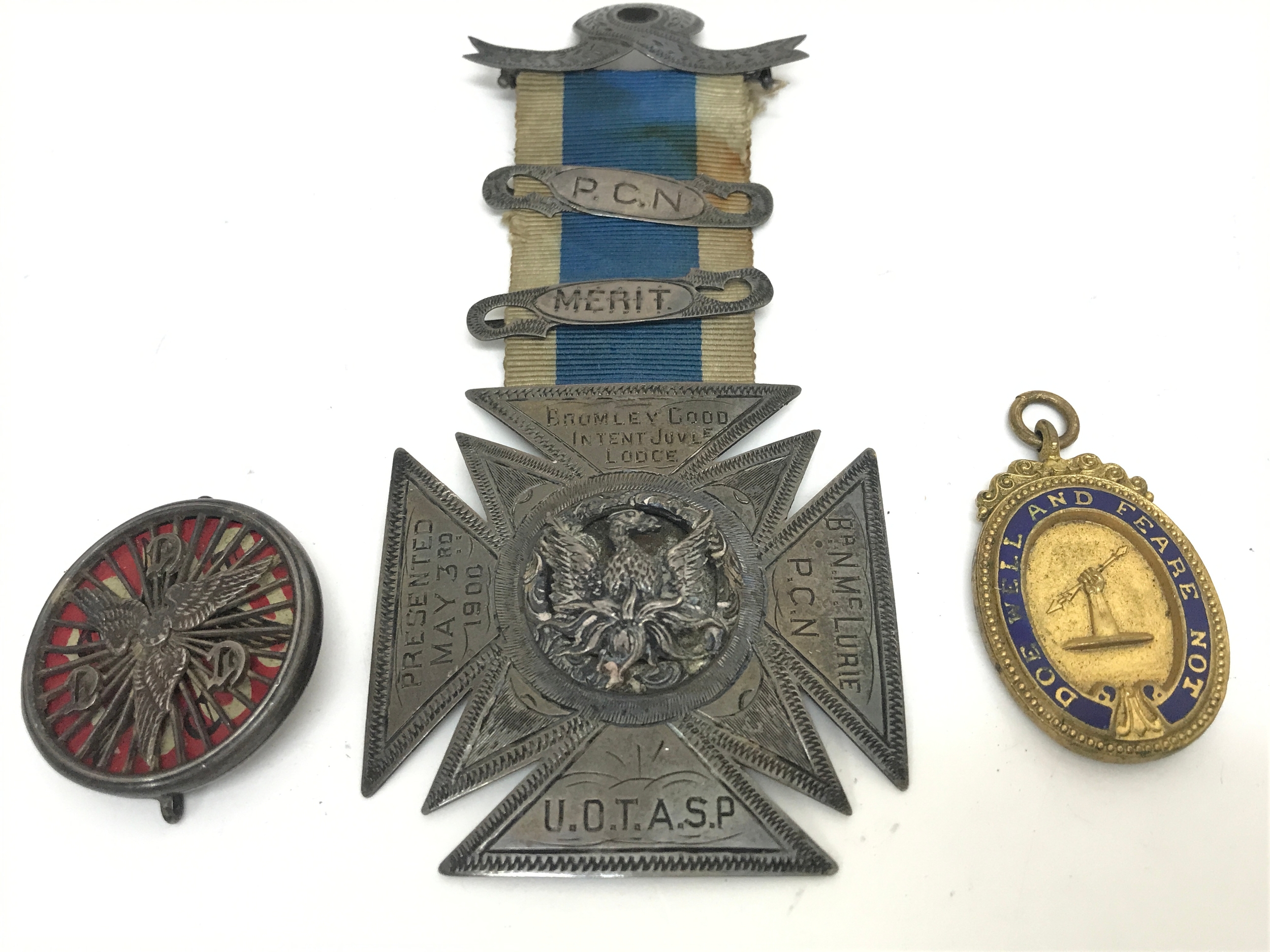 A silver lodge merit jewel presented may 3rd 1900 Bromley Good intent Juvle Lodge, a West Ham Conservative for goodwork done jewel and a Cycling tourist membership certificate badge