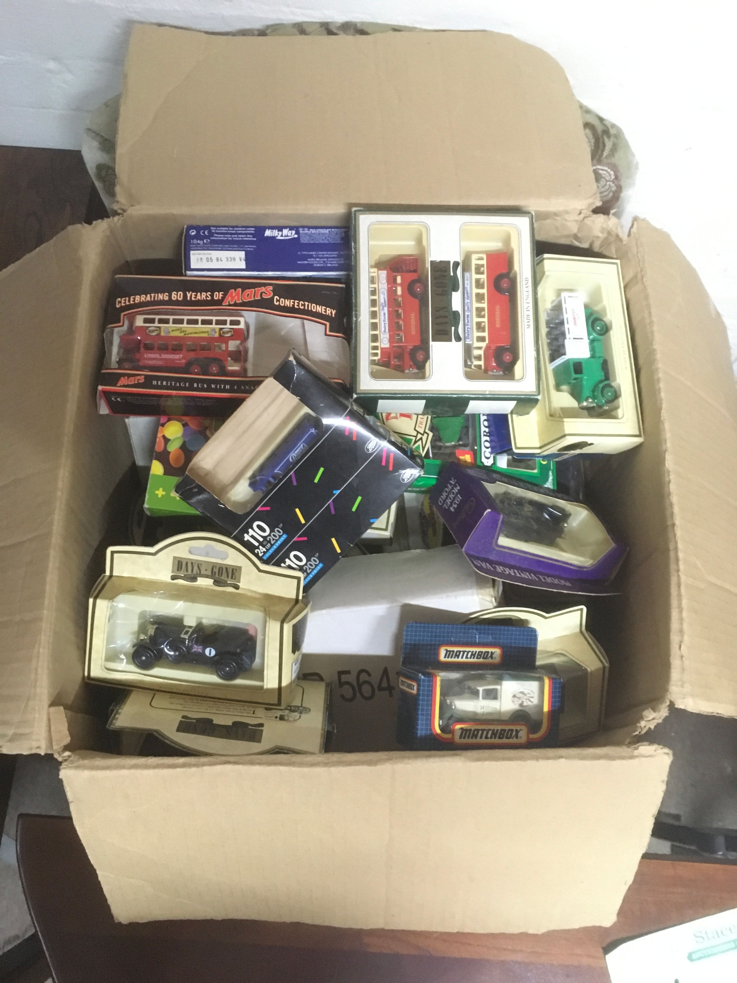 A large box of model cars featuring Days gone, matchbox etc. 