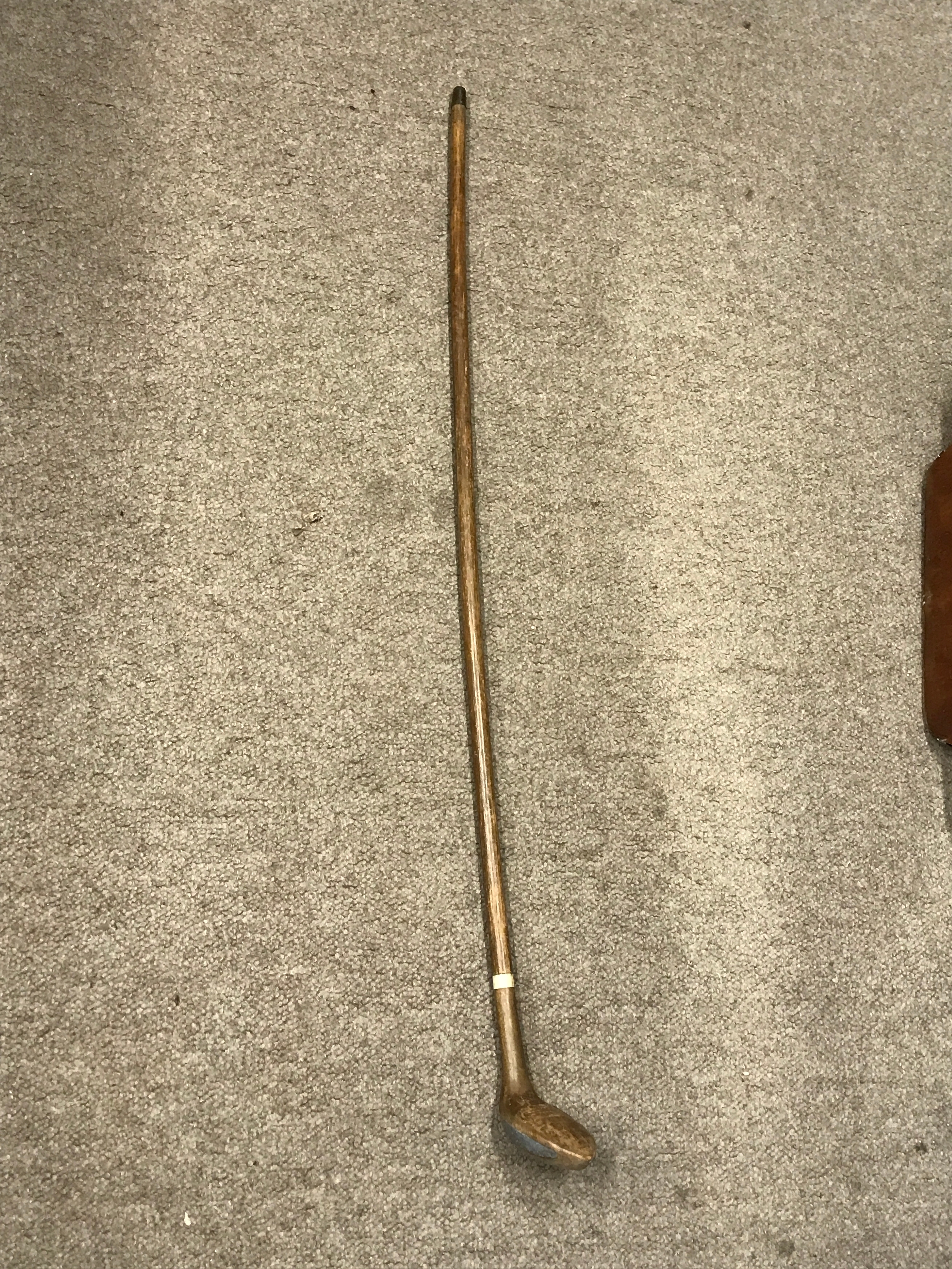 A vintage golf club, 88cm long