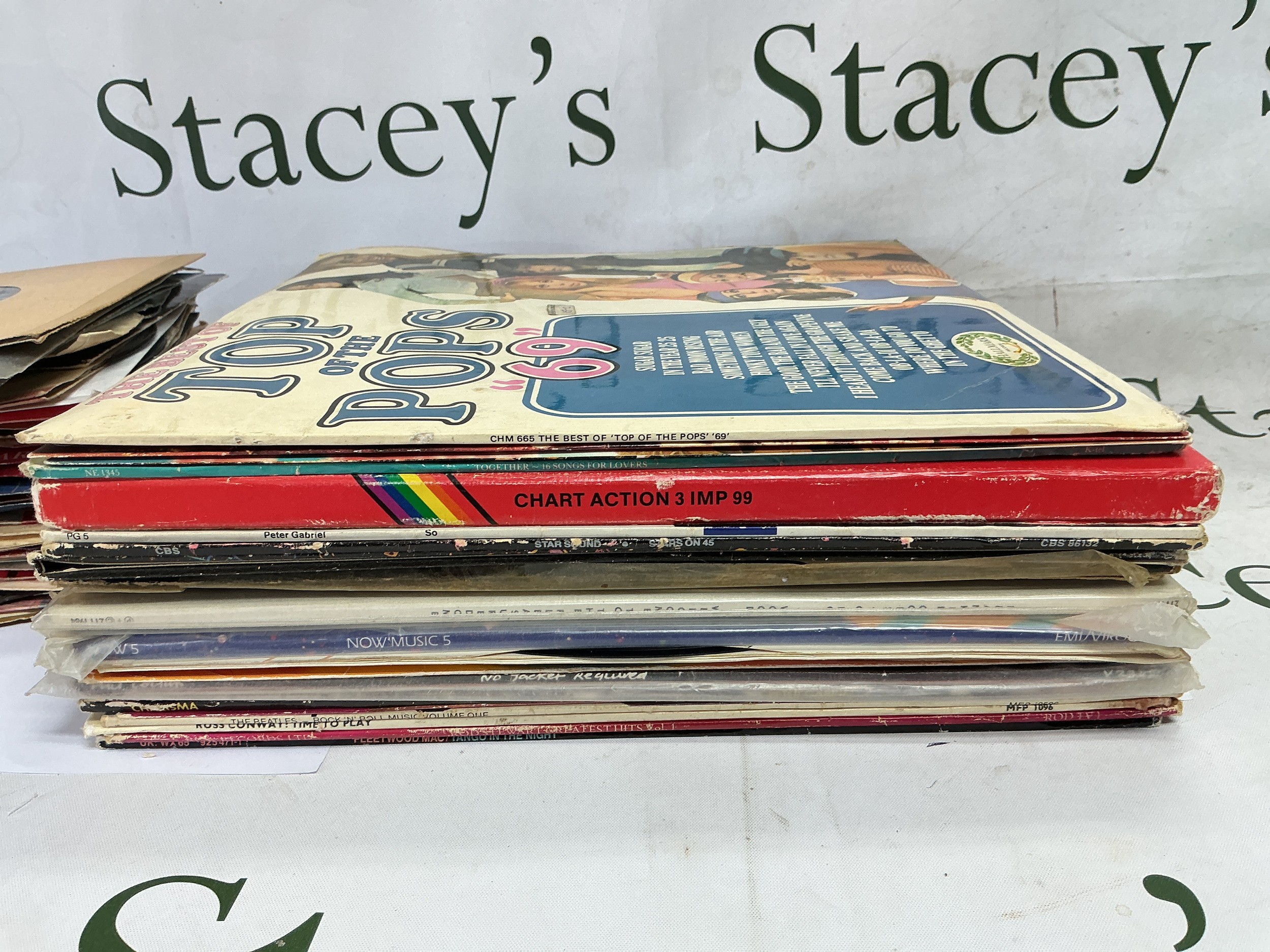A collection of LPs and 12" and 7" singles by various artists including The Beatles, Fleetwood Mac, Peter Gabriel and others.