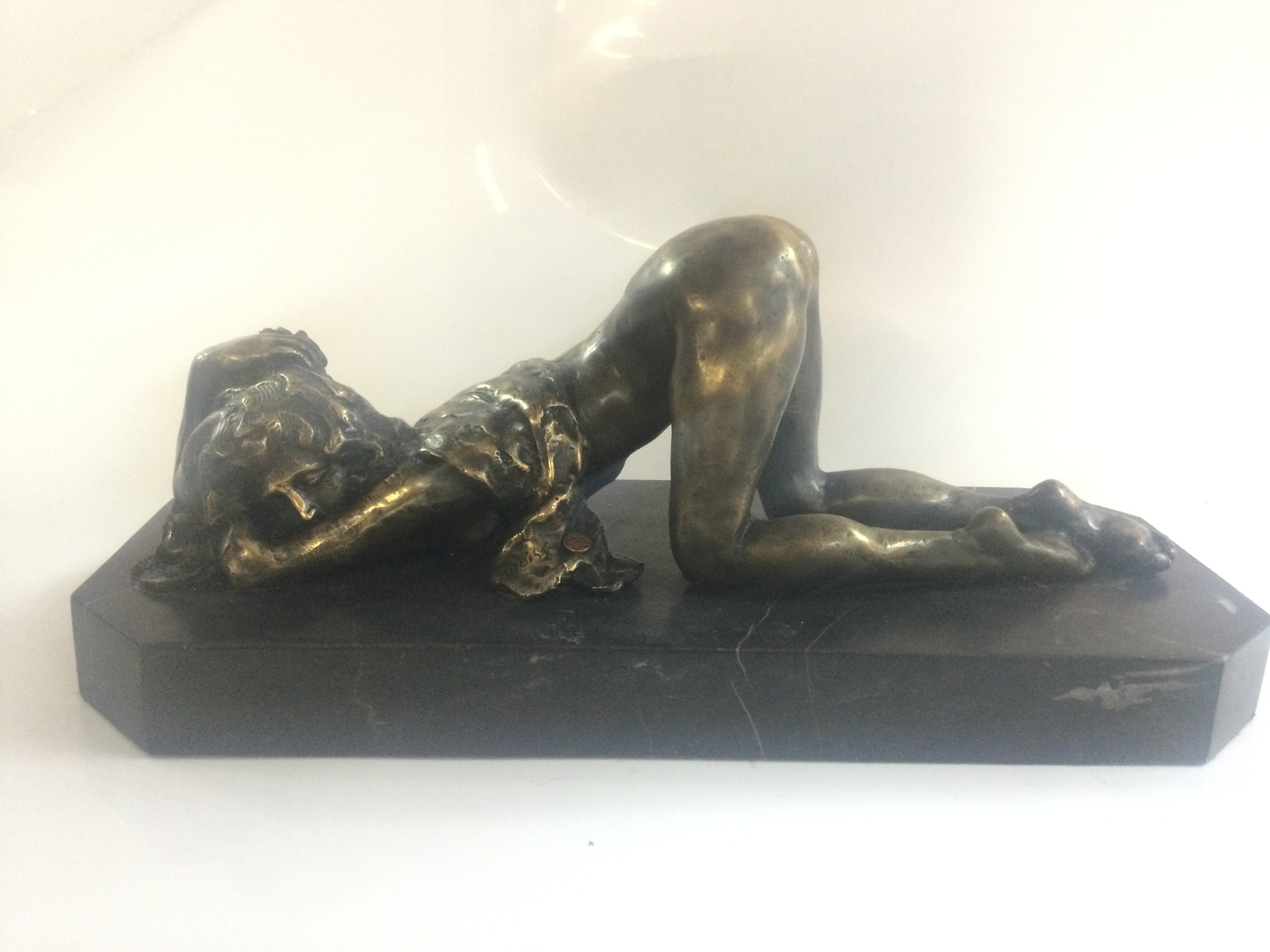A bronze nude woman figure signed Pyeiss. 43cm wide 18cm tall