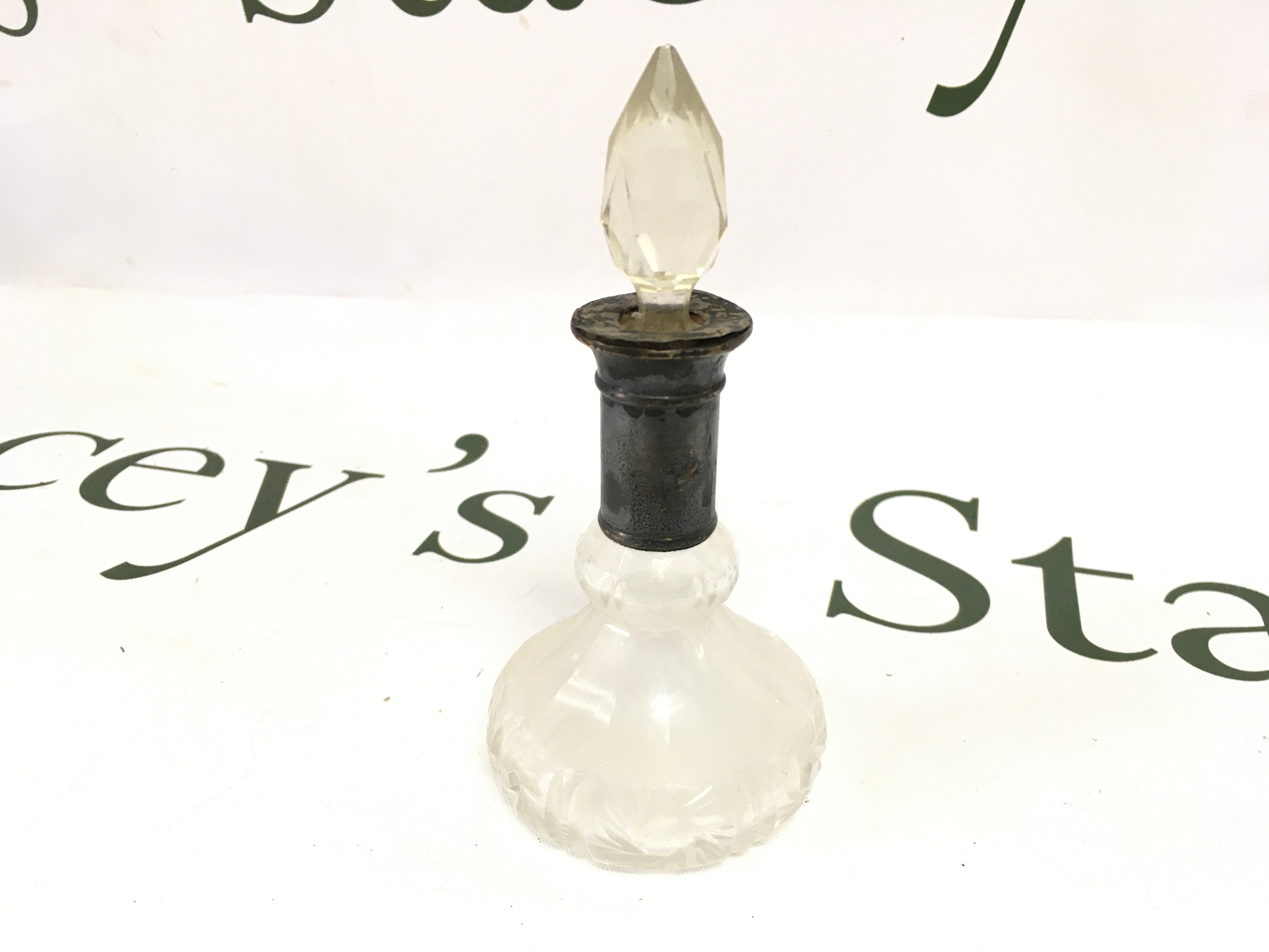 A Hallmarked silver perfume bottle. 13cm tall